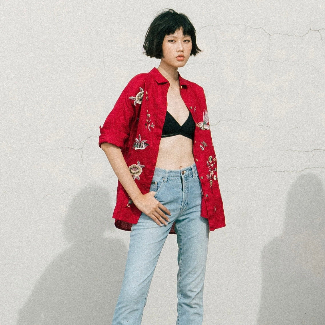 "Fire Phoenix" embroidered red linen shirt by Huulala, featuring floral patterns, Vietnamese cultural design.