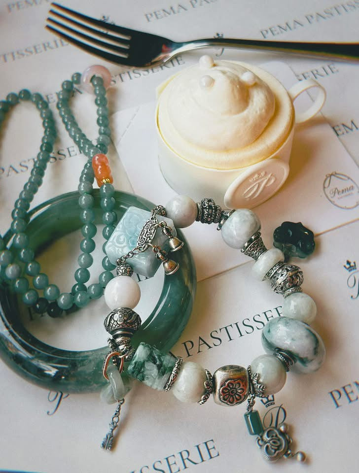Bích Tâm An” – Designer's Green Jade Serenity Bracelet - flat lay display in green by HI de Maison