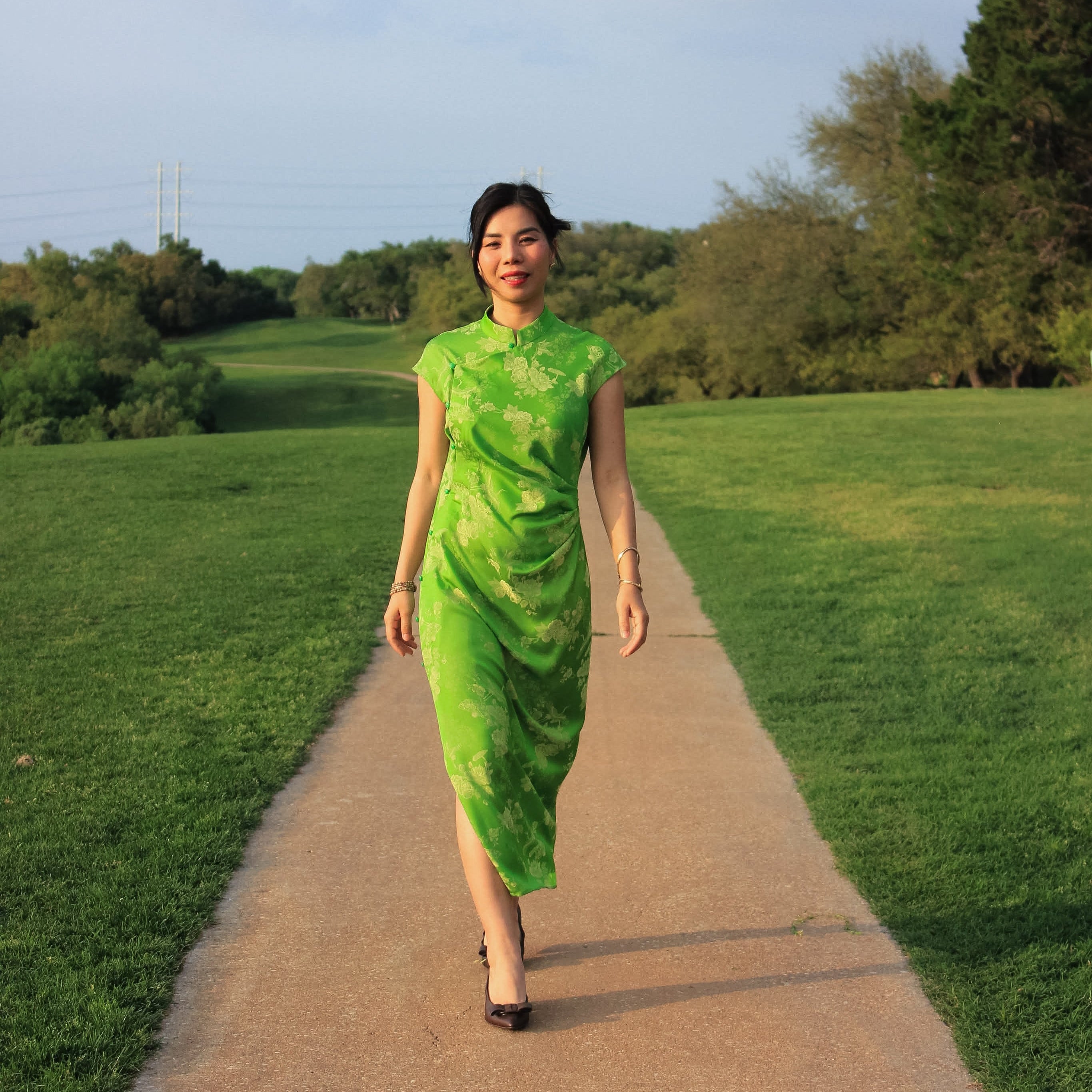 "Sleeveless green cheongsam top by Hy Phuong in silk jacquard, modern Vietnamese design"