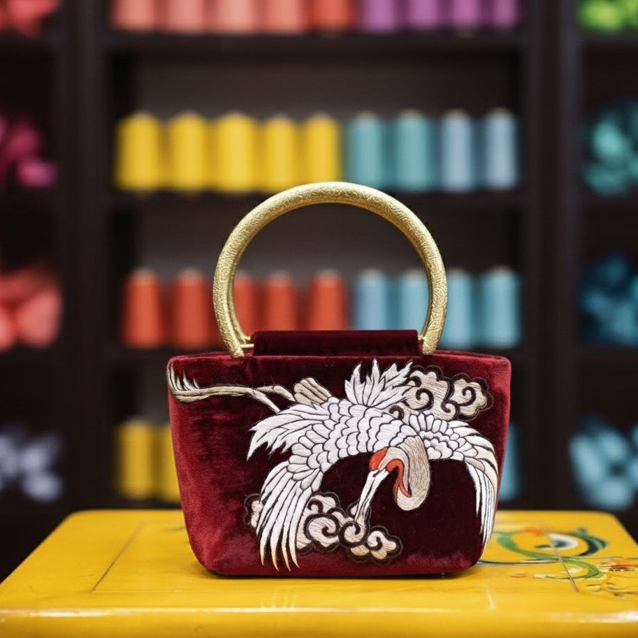 Vietnamese Embroidery - Hạc Vân - Embroidered Velvet Handbag with Hand-cast Brass Handle - front view in maroon by Tho