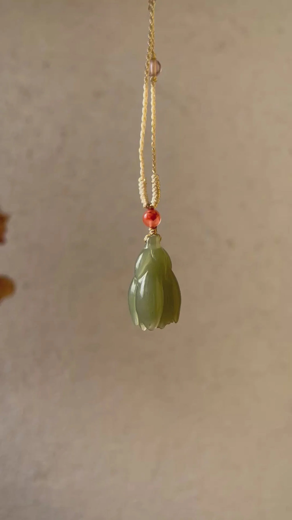 “Magnolia Dawn” - Hand Carved Light Green Hetian Jade Magnolia Pendant，手雕和田青黄口玉兰花 - detail close-up in green by L'Orient Haus