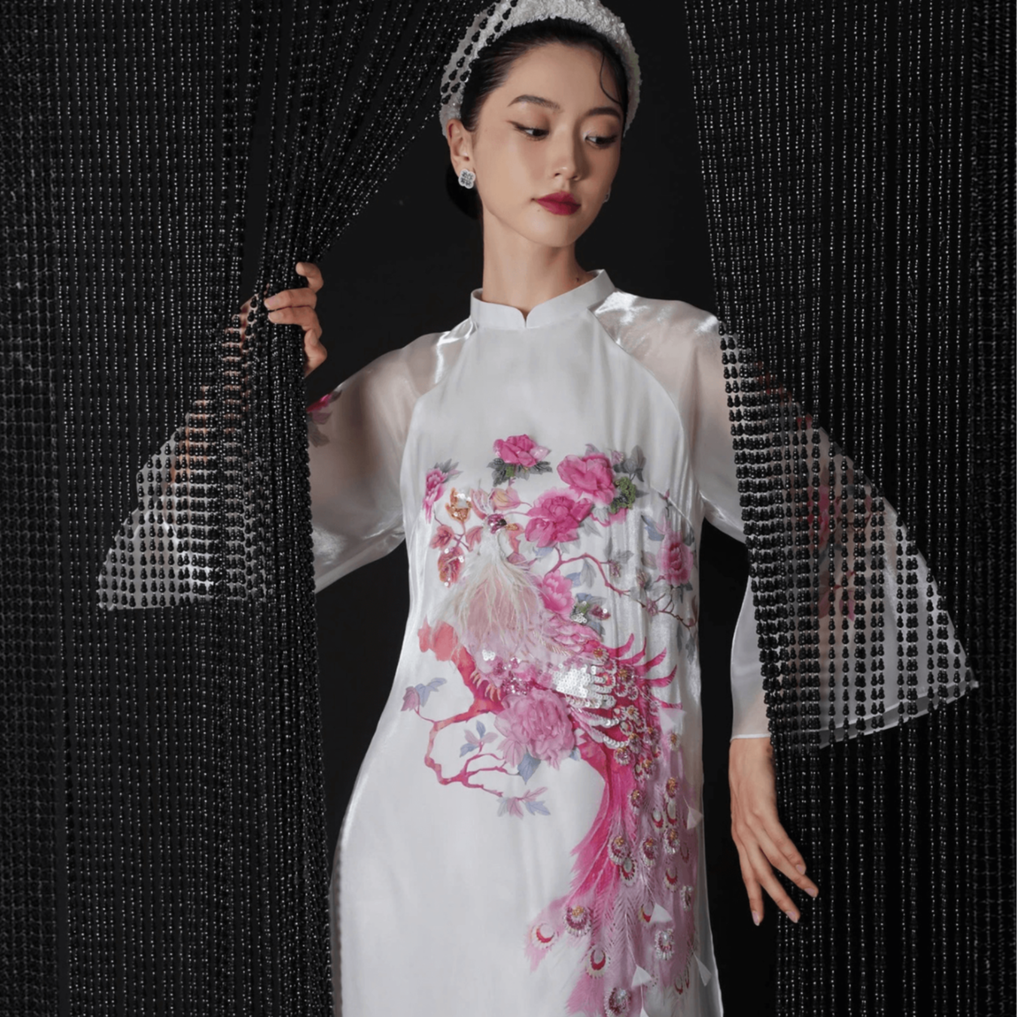 "Hong Loan luxury white silk Ao Dai with red floral embroidery, traditional Vietnamese dress by Lalin."