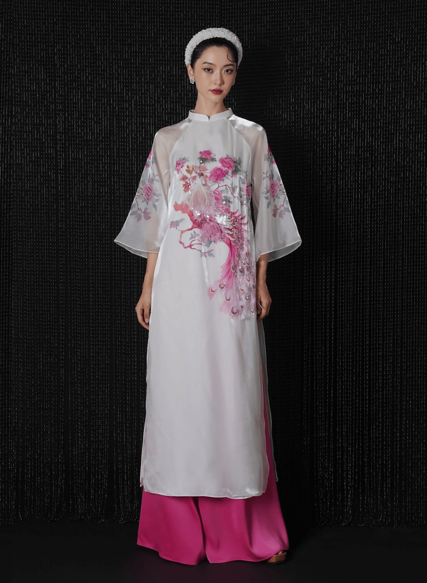 "Luxury white silk Ao Dai with red embroidery, traditional Vietnamese dress by Lalin."