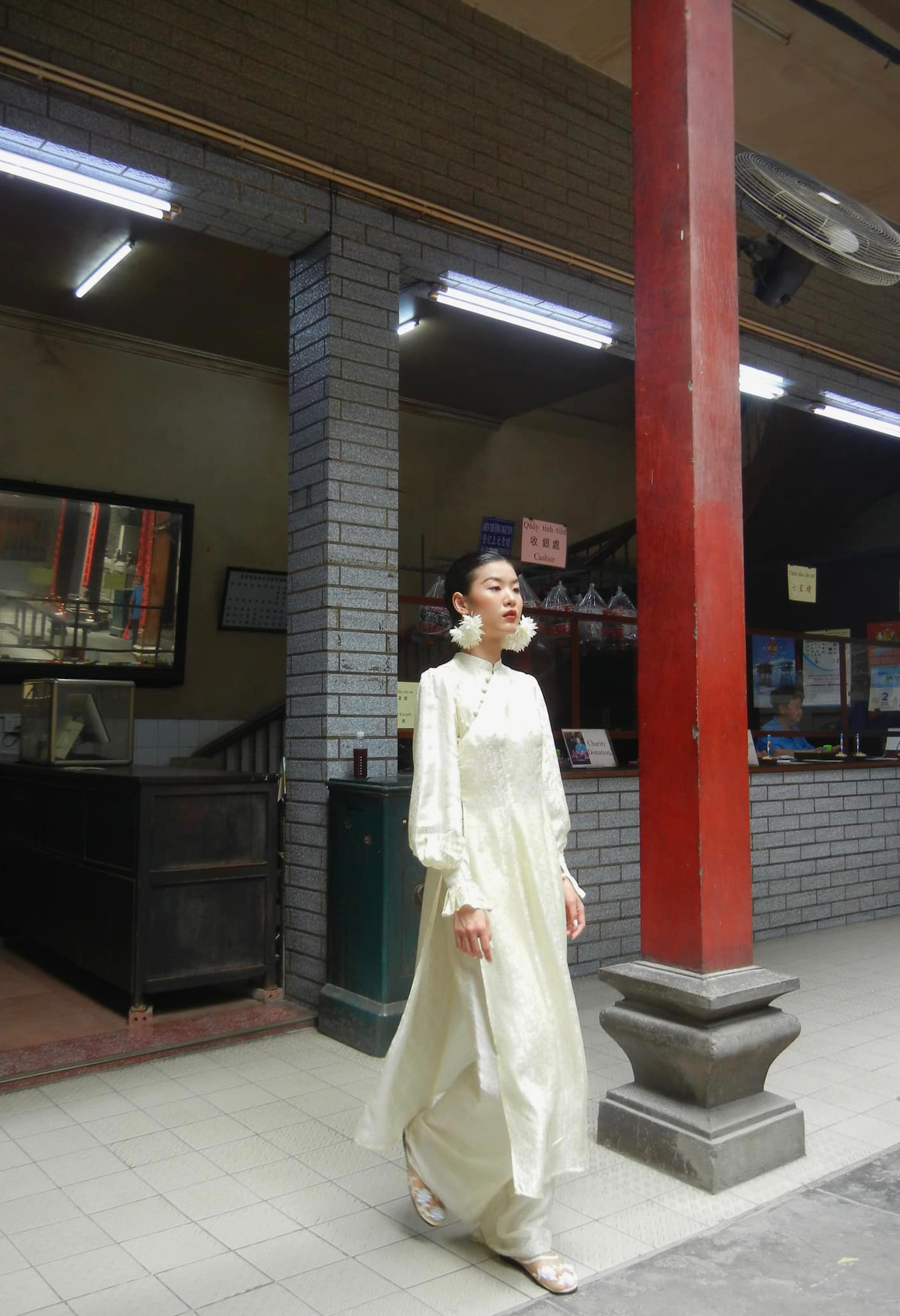 "Tang Bong Ao Dai Set in cream silk with puff sleeves, traditional Vietnamese dress by SY Design."
