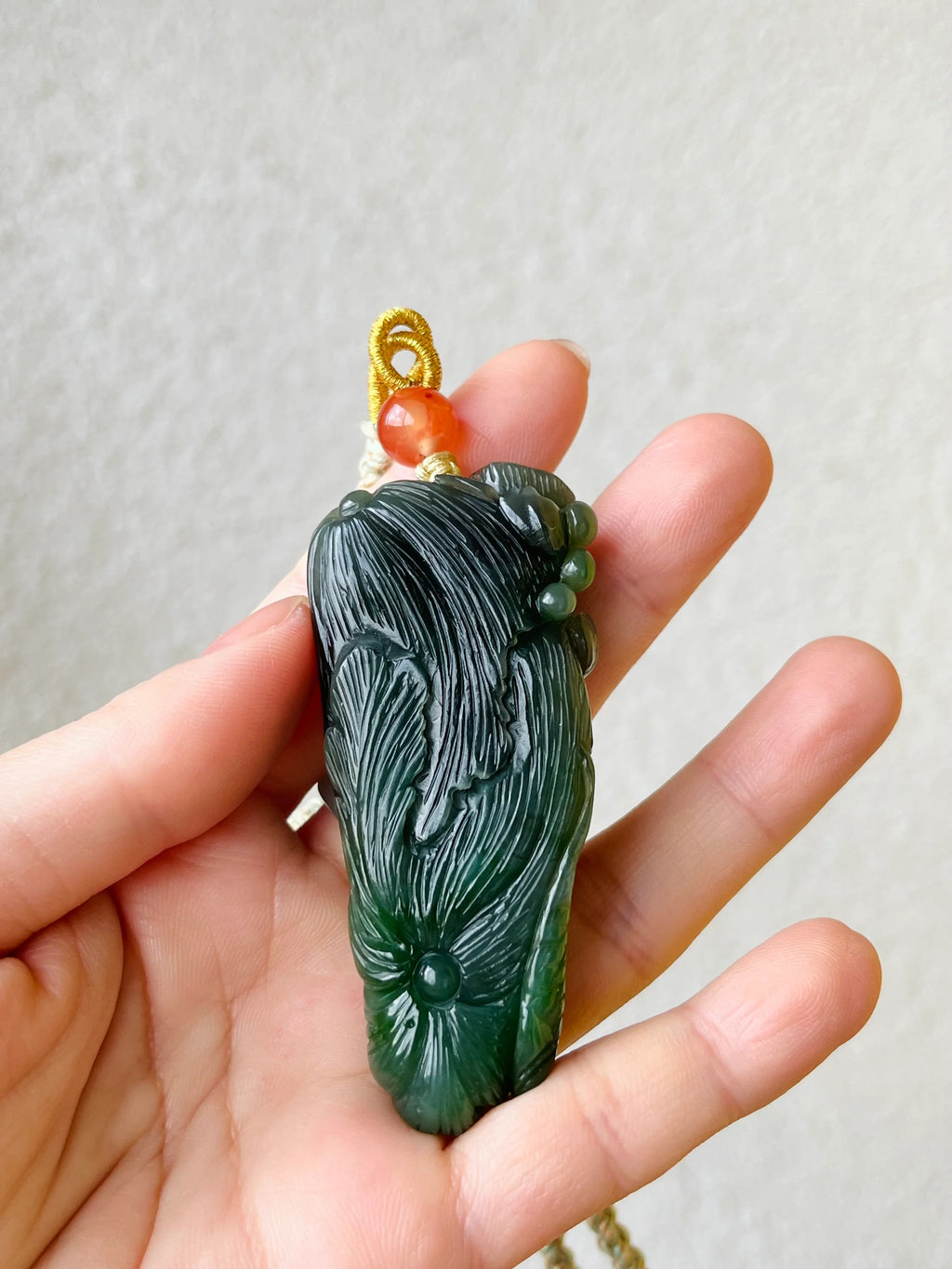 “Lotus Blessing ”- Hand Carved Green Hetian Jade Fish and Lotus Pendant, 手雕碧玉荷花鱼手把件 - detail close-up by L'Orient Haus