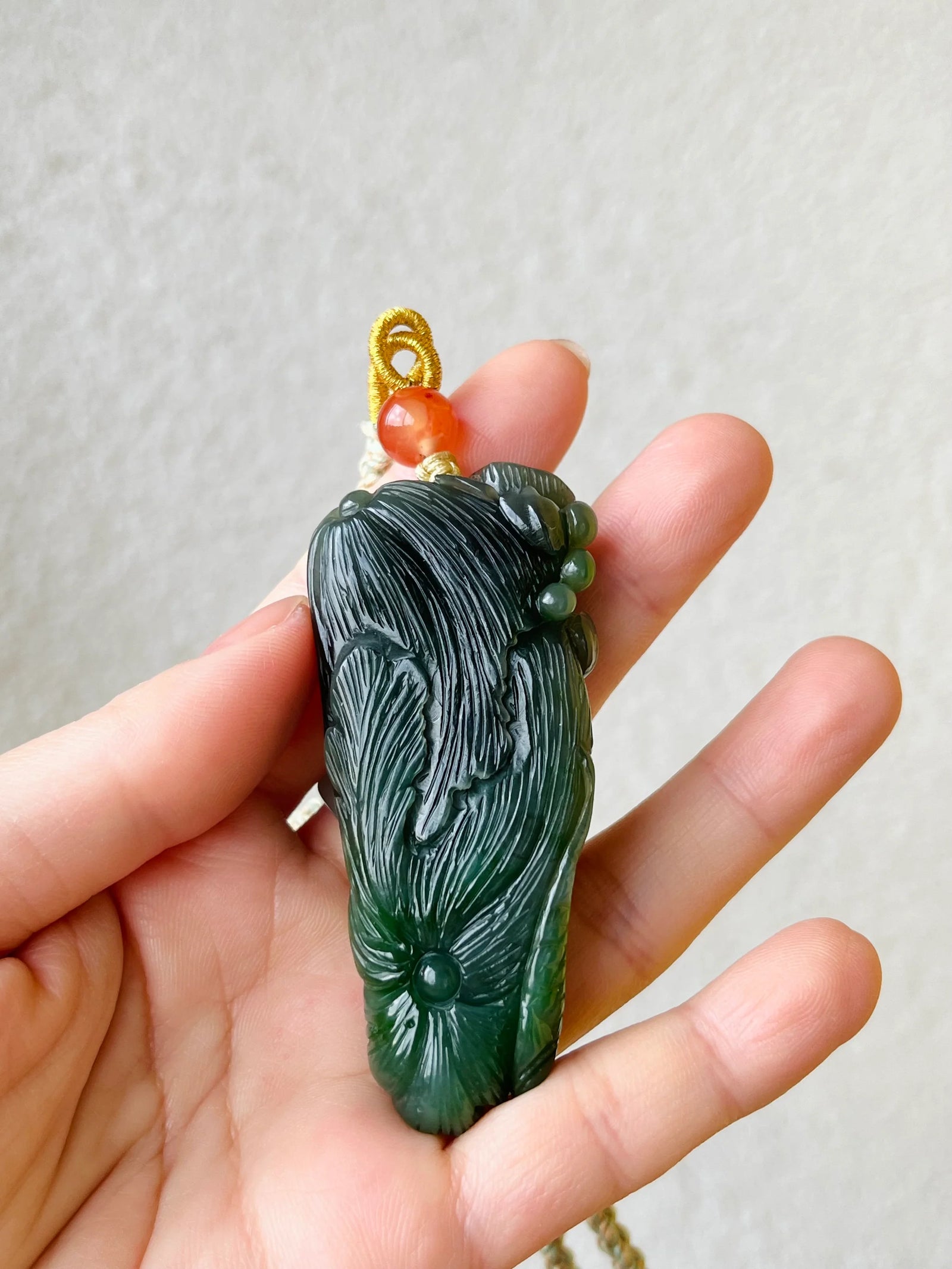 “Lotus Blessing ”- Hand Carved Green Hetian Jade Fish and Lotus Pendant, 手雕碧玉荷花鱼手把件 - detail close-up by L'Orient Haus