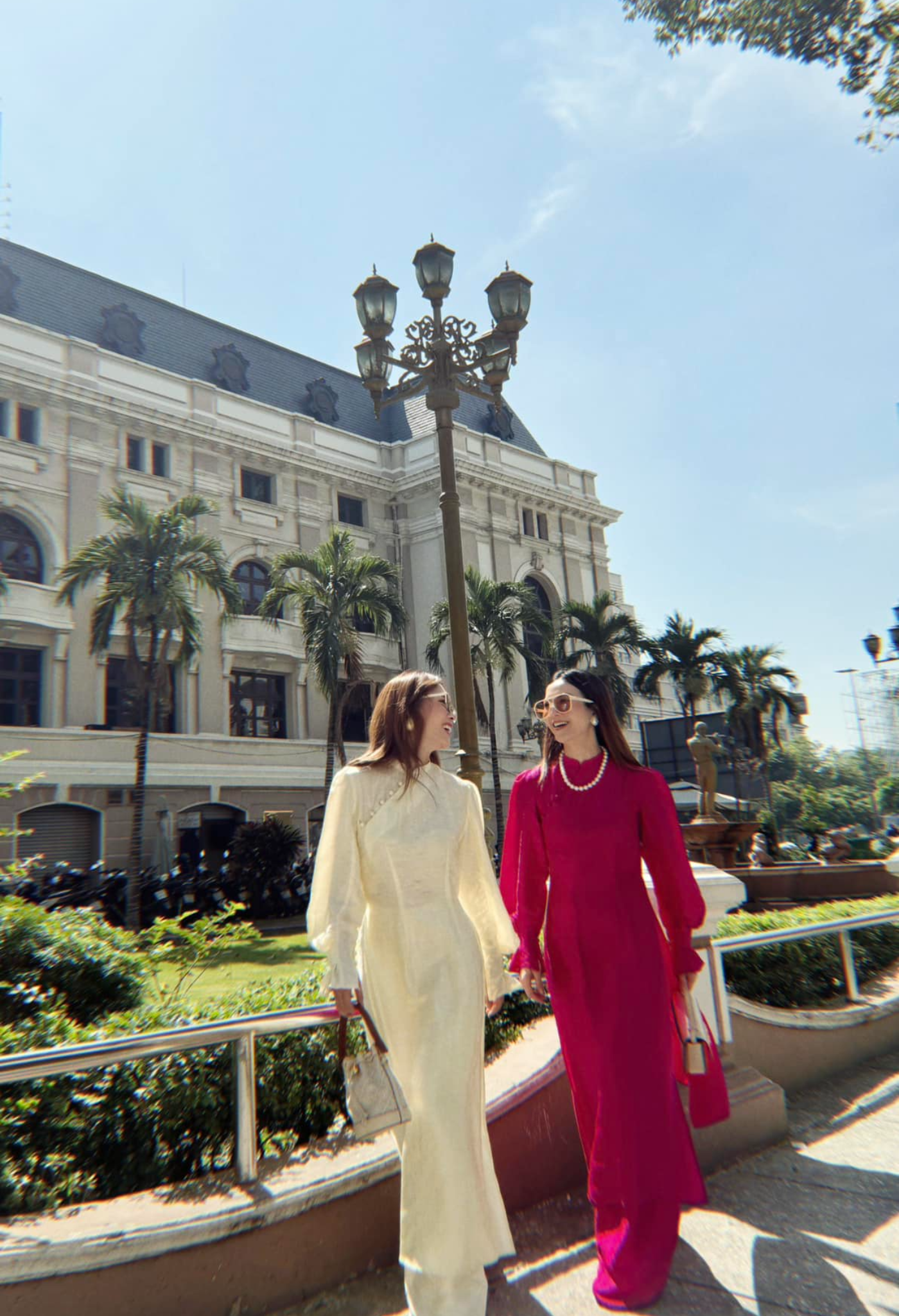 "Traditional Vietnamese Ao Dai set in cream and red silk with puff sleeves, floral jacquard pattern by SY Design."
