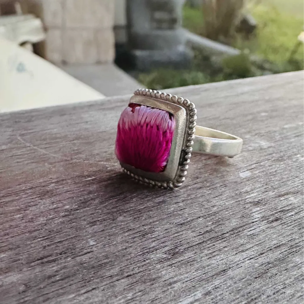 Spring Bloom Miao ring close-up showing embroidery and silver base