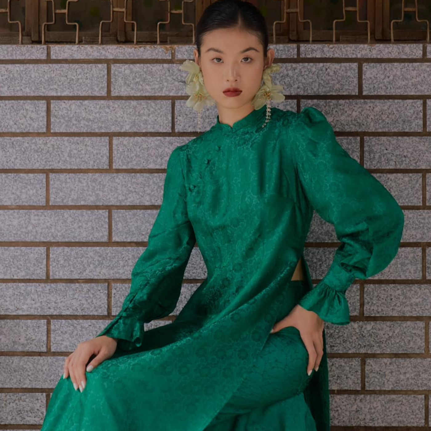 "Green silk Ao Dai set with puff sleeves, floral jacquard pattern, traditional Vietnamese design by SY Design."