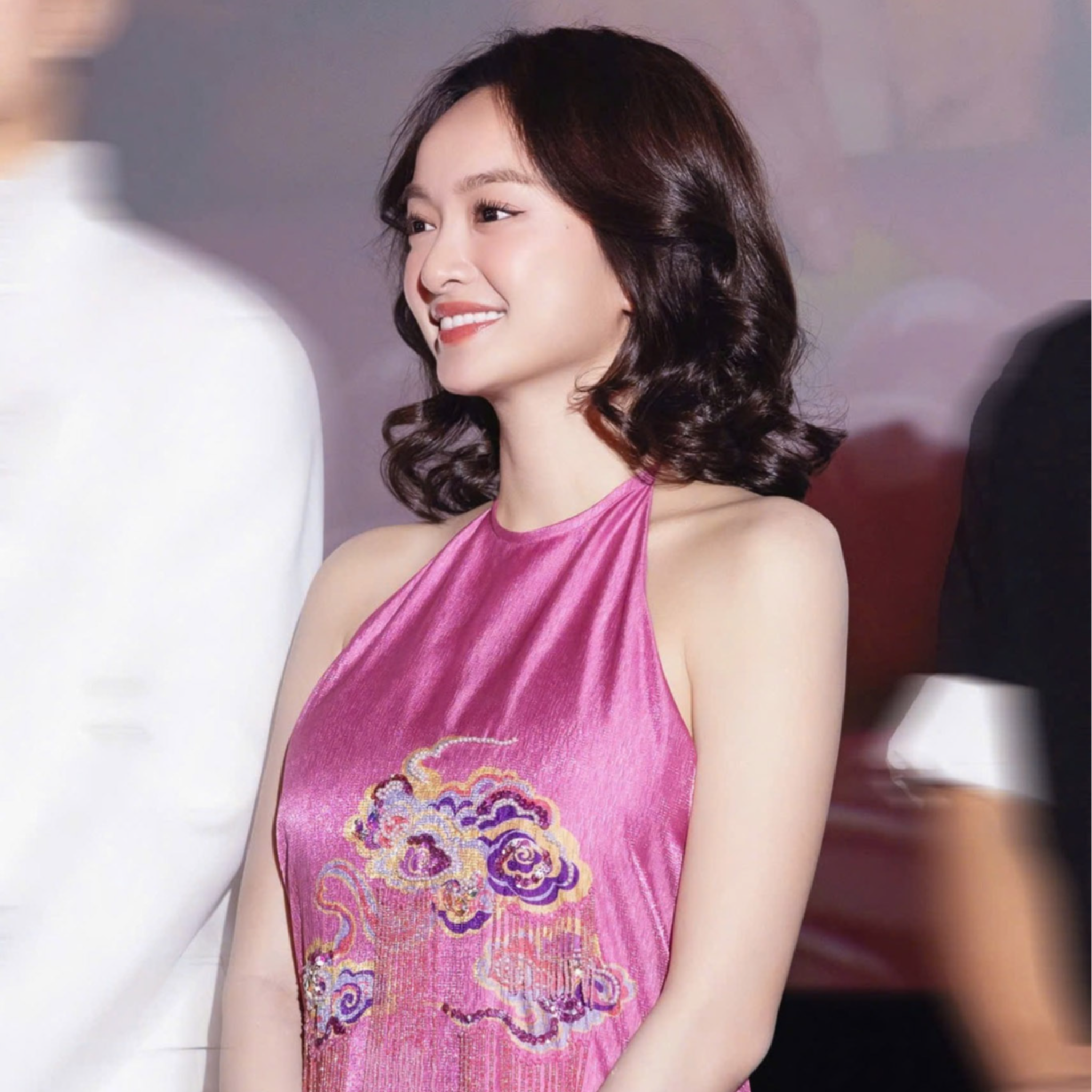 "Uyen Van luxury pink velvet Ao Dai halter dress with cultural embellishments by Lalin"