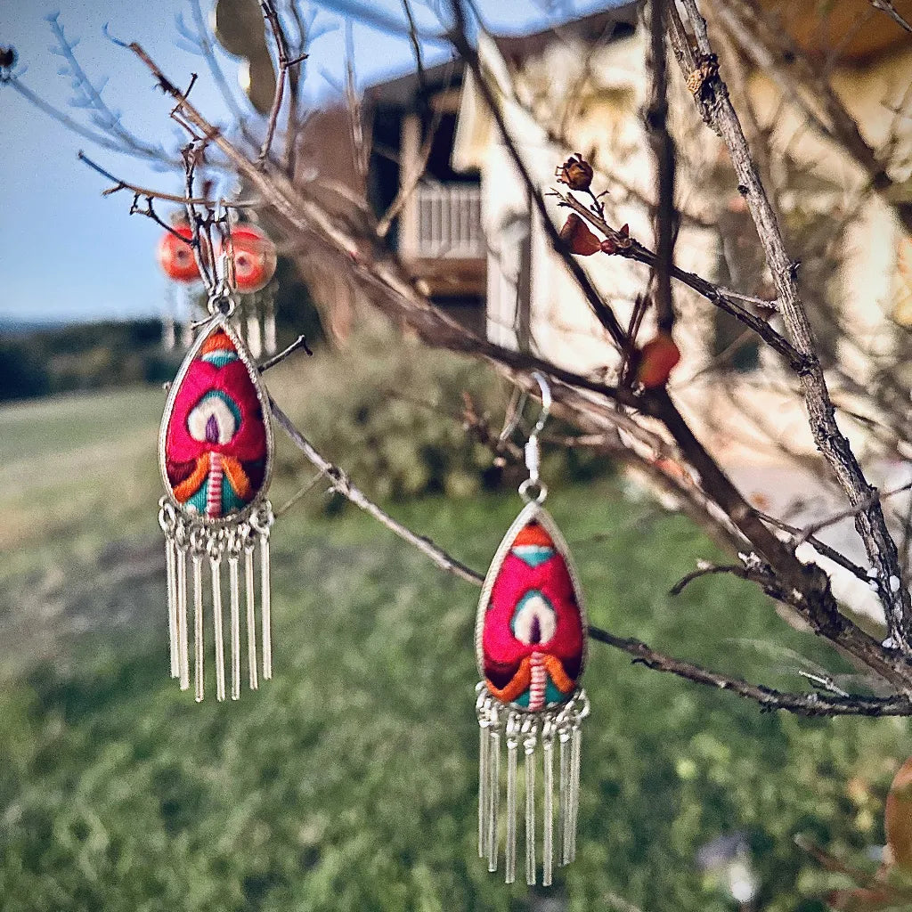Phoenix Petal Miao earrings detail showing phoenix and petal embroidery motifs