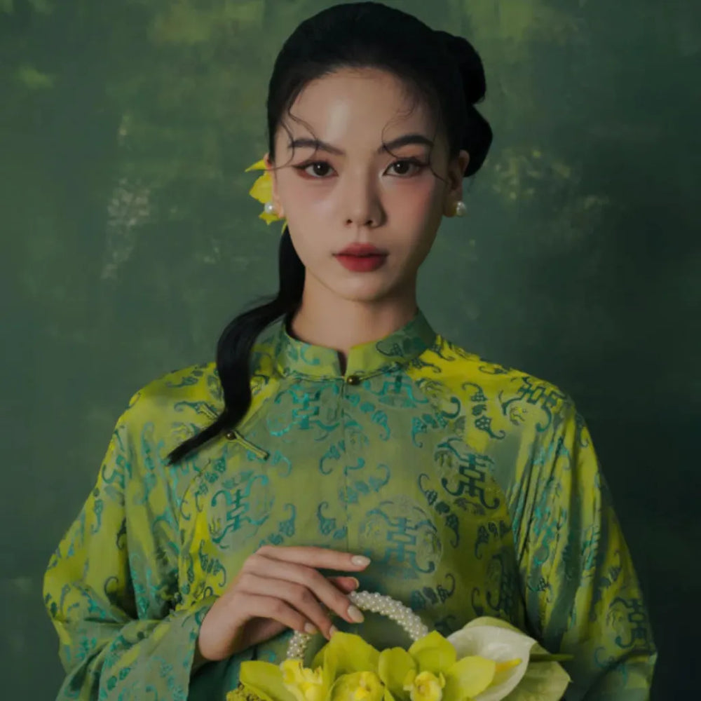 Banner image for the "Ao Dai " section of the website (Mobile). a girl wearing a green Ao dai
