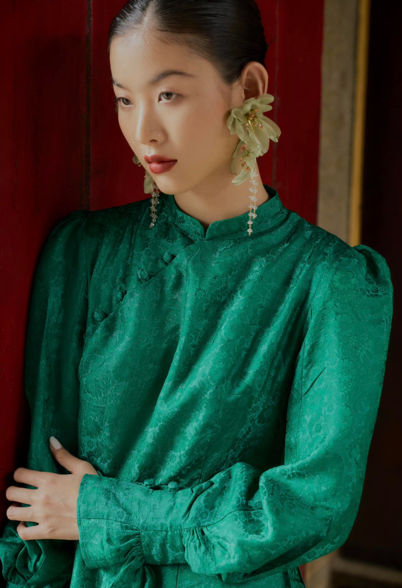 "Tang Bong Ao Dai Set in green silk with puff sleeves, traditional Vietnamese dress by SY Design."