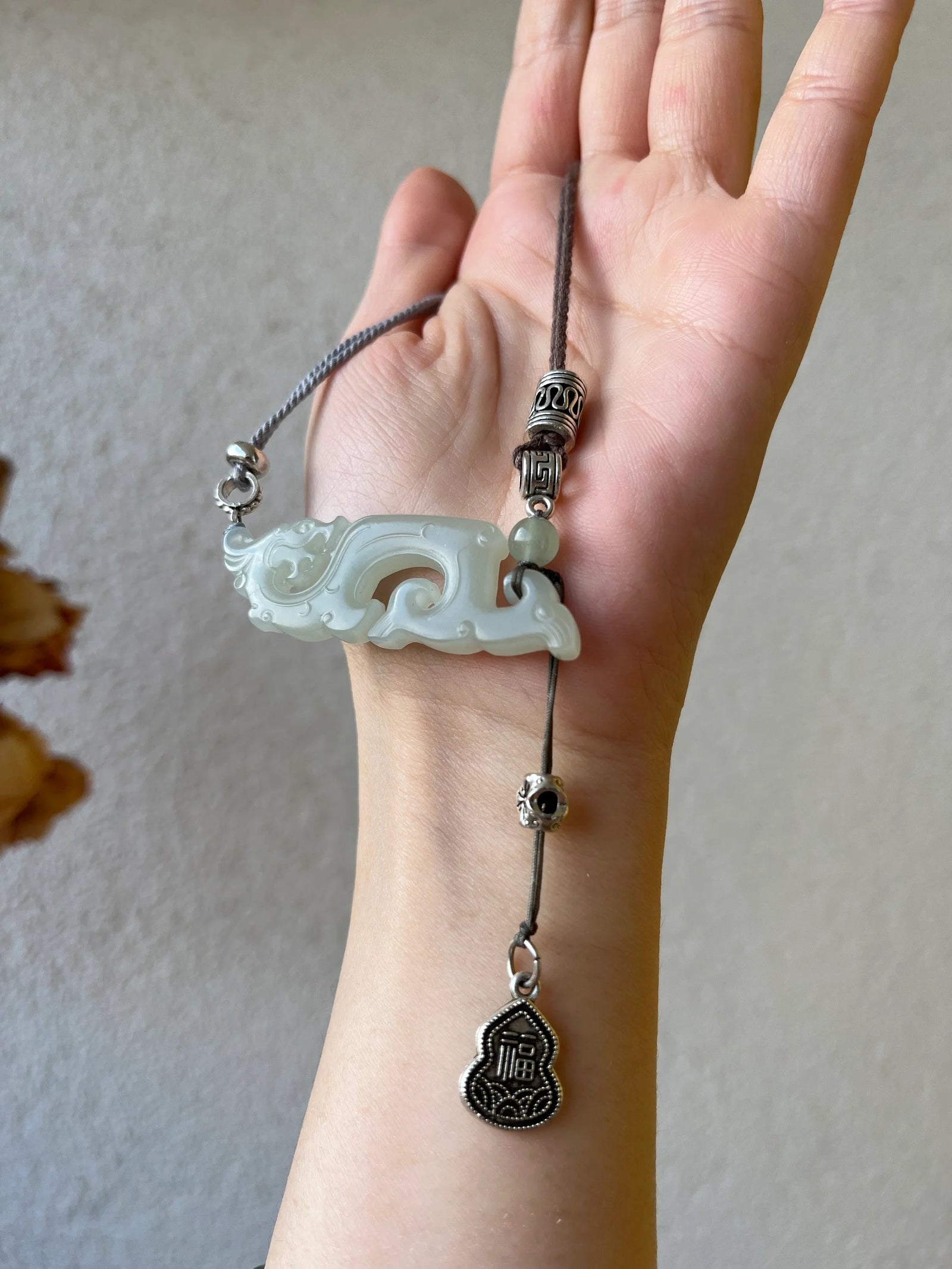 Traditional Motif - Celestial Dragon – Hand-Carved Nephrite Jade Necklace - worn presentation in white by L'Orient Haus