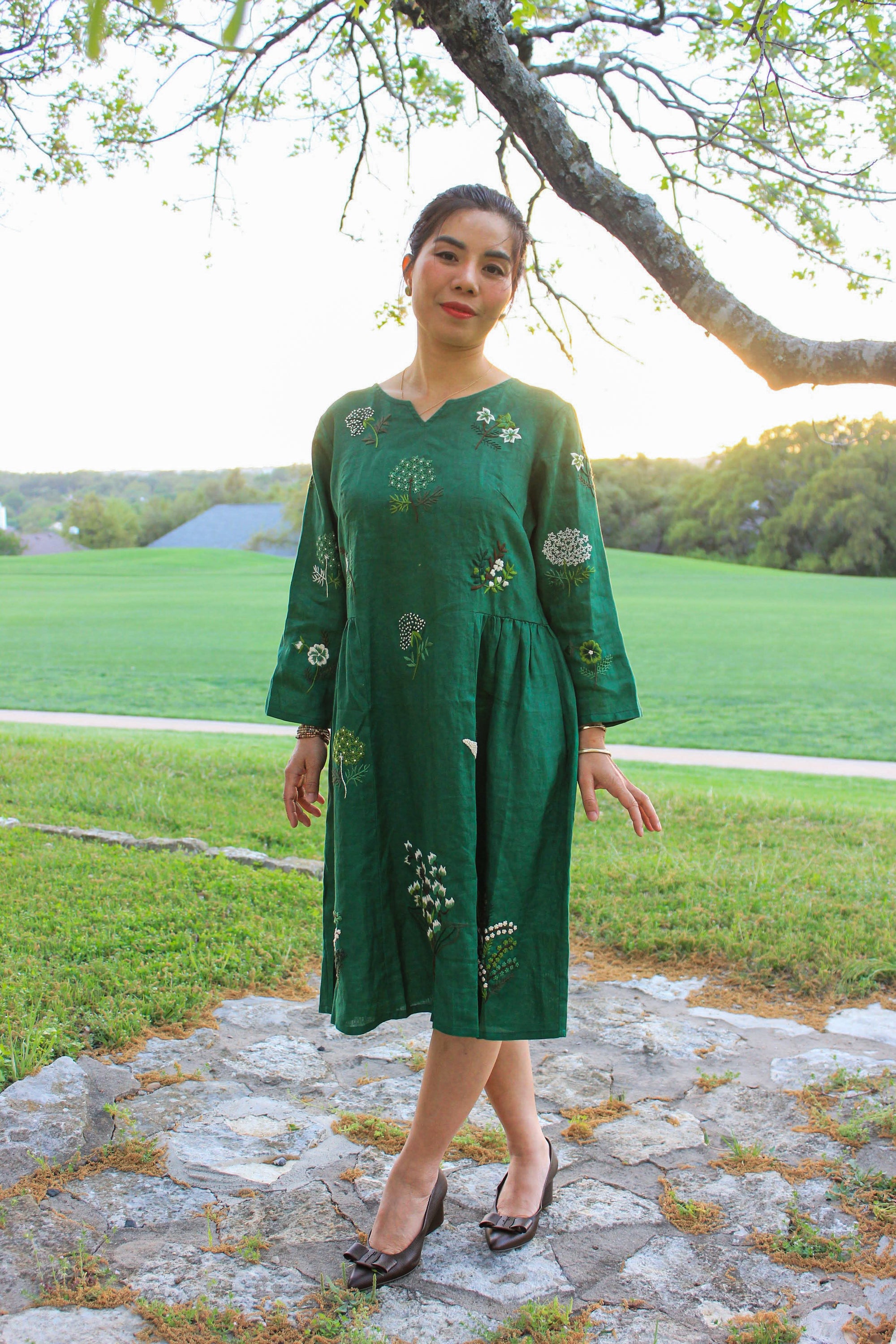 "Vietnamese Mimosa embroidered green linen dress by Huulala with floral pattern"