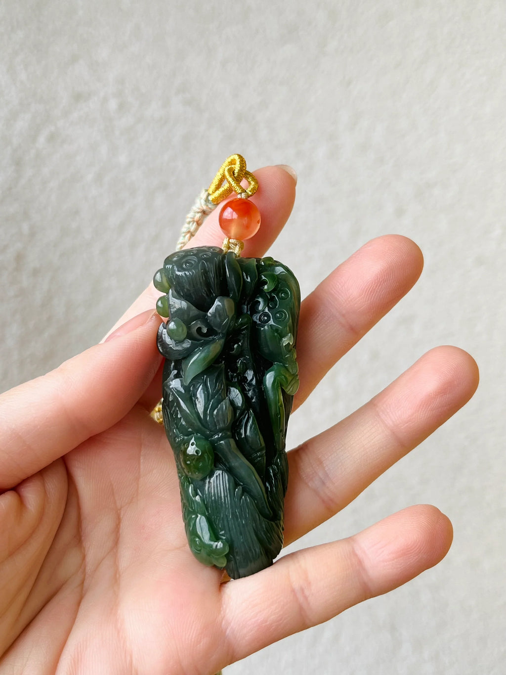 “Lotus Blessing ”- Hand Carved Green Hetian Jade Fish and Lotus Pendant, 手雕碧玉荷花鱼手把件 - detail close-up by L'Orient Haus