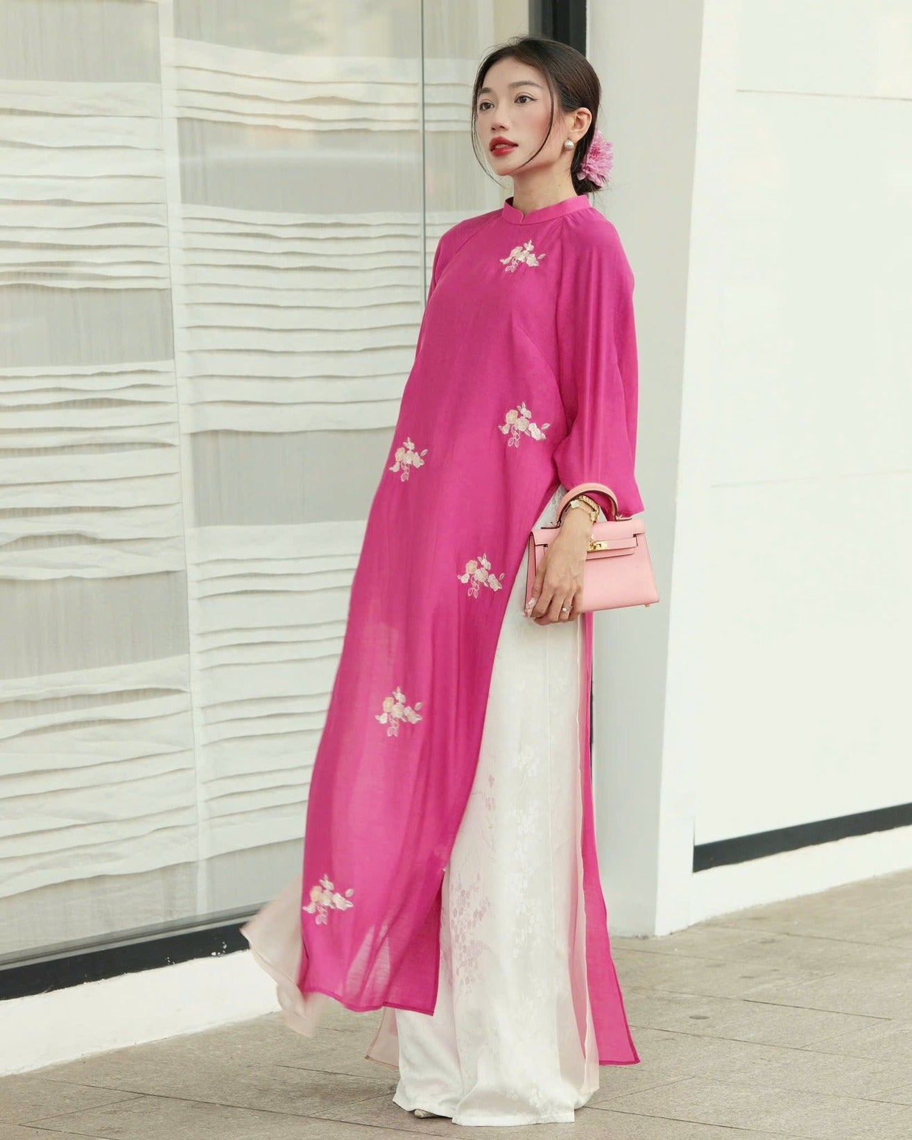 "Traditional Vietnamese Ao dai set in pink chiffon with floral pattern, white silk pants"