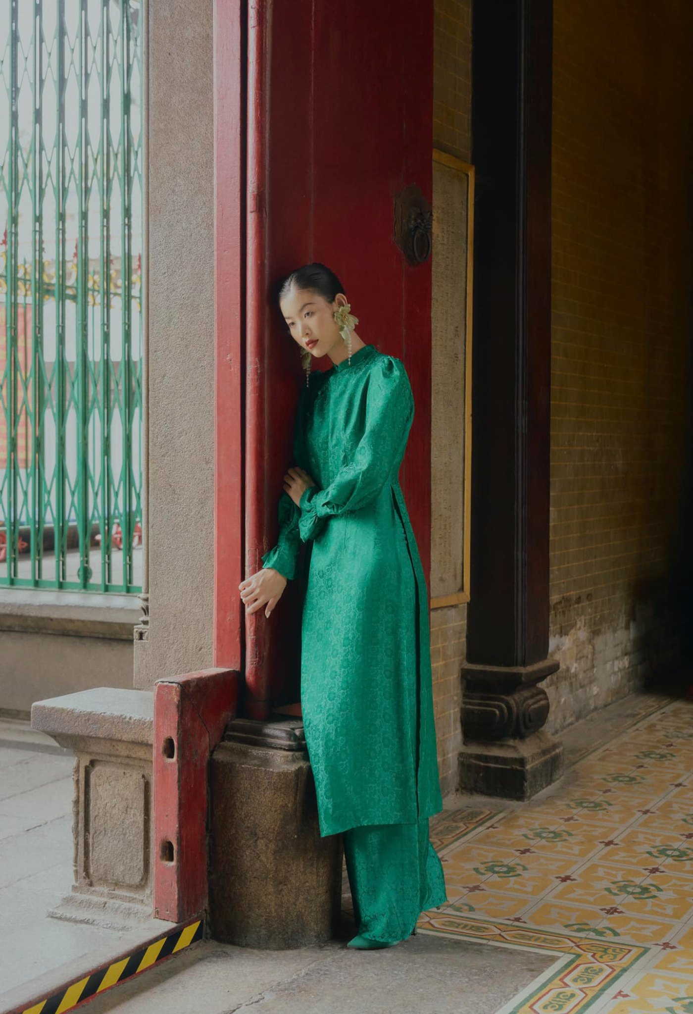 "Tang Bong Ao Dai Set in green silk with puff sleeves, traditional Vietnamese dress by SY Design."