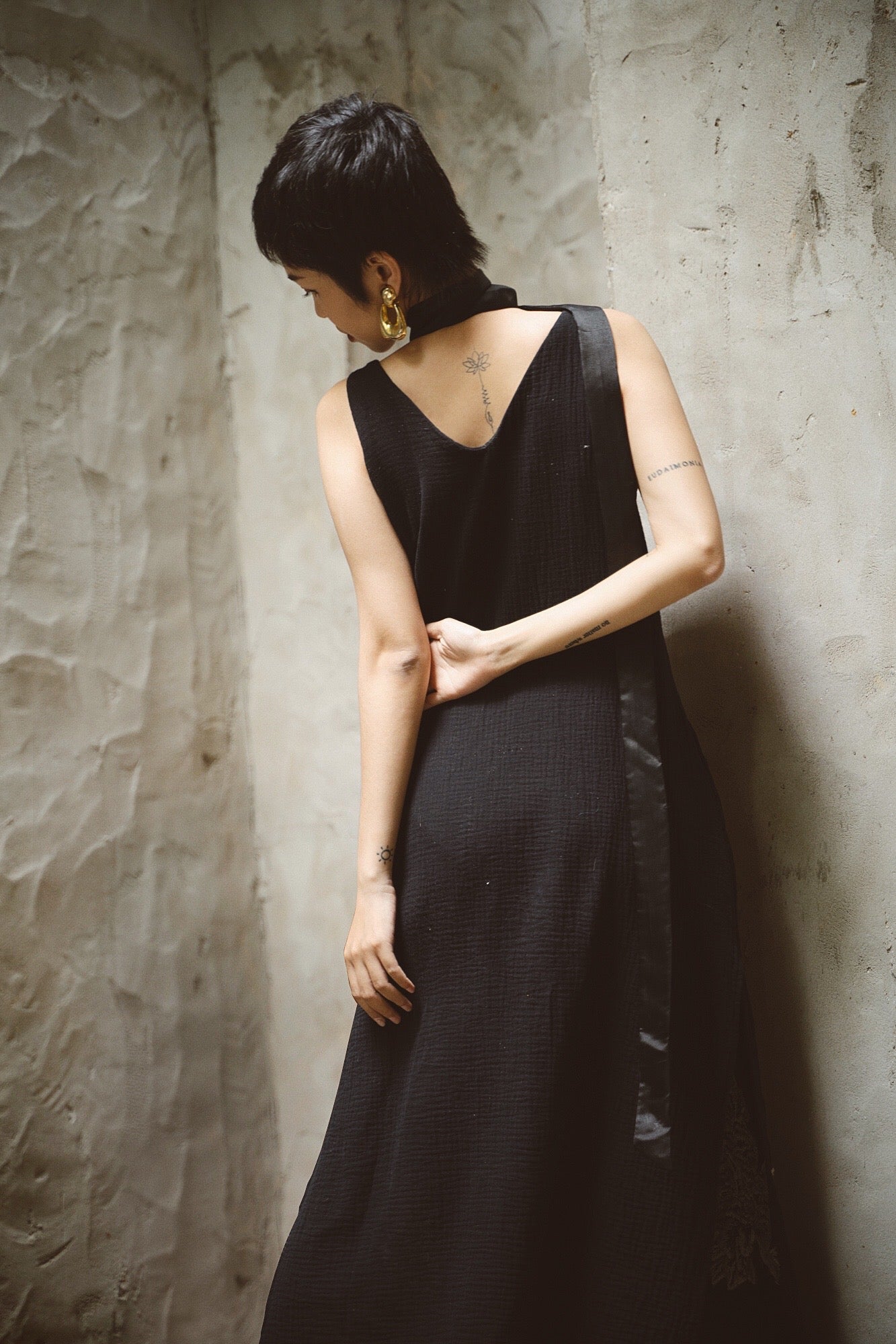 "Night Bloom" - Vietnamese embroidered V-neck muslin dress in black with floral pattern.