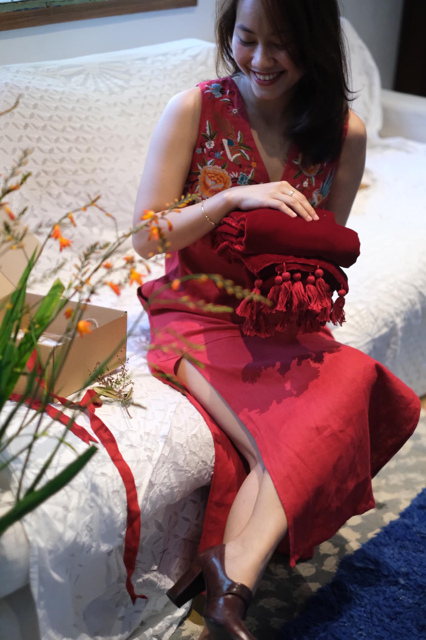 "Phoenix and Flowers" red linen dress with floral embroidery, Vietnamese artisan design.