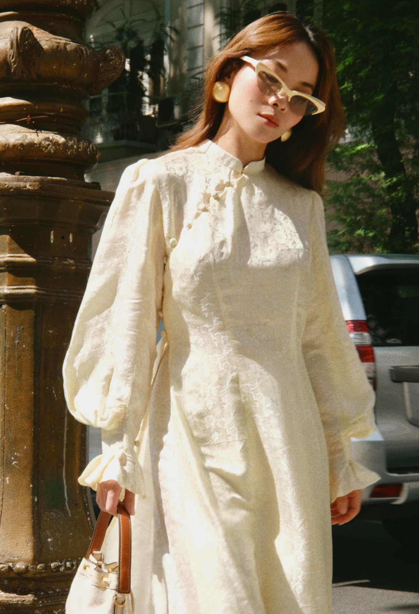 "Tang Bong Ao Dai Set in cream wormsilk with puff sleeves, traditional Vietnamese dress by SY Design."