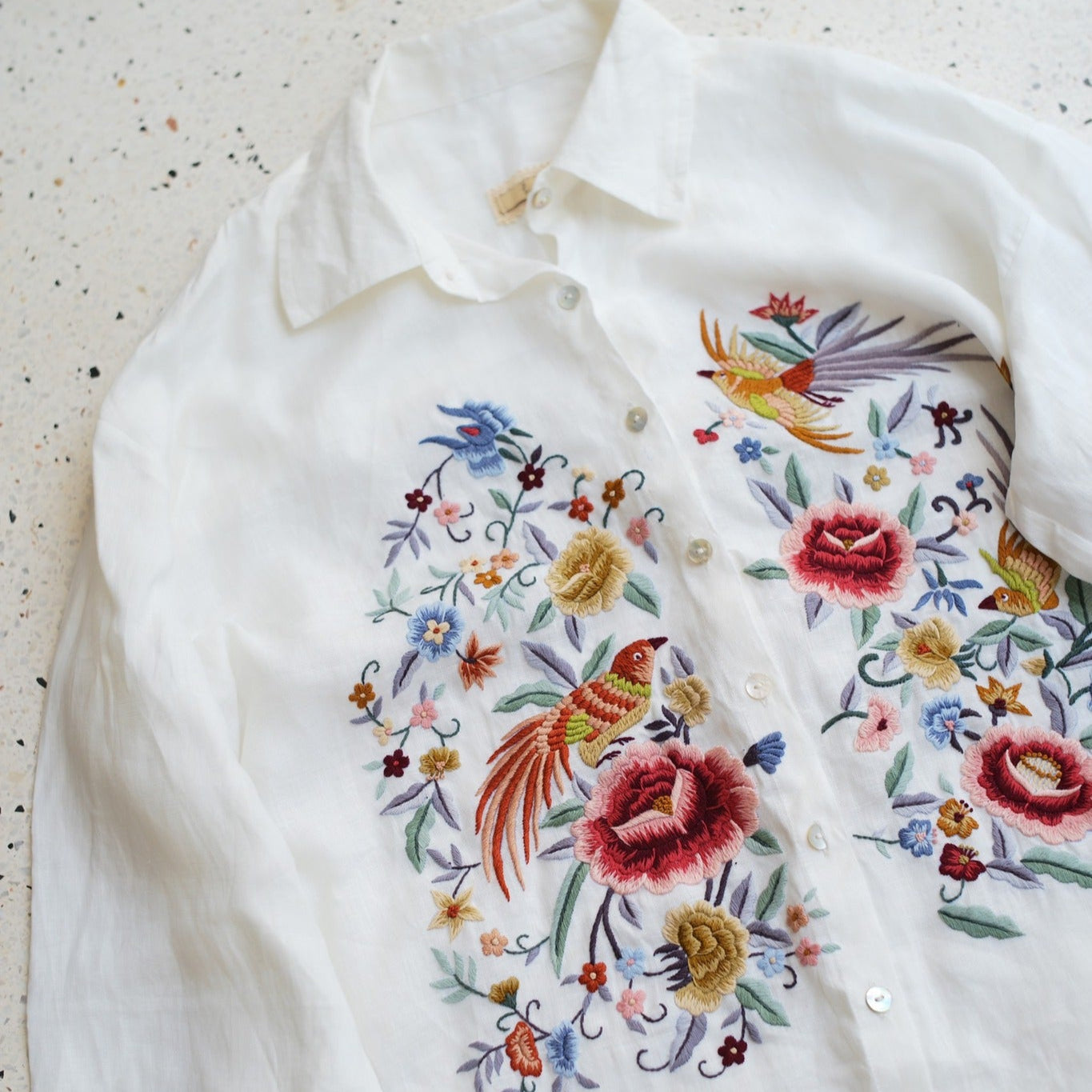 "Zoya embroidered linen shirt in white with pink floral embroidery, Vietnamese design by Huulala"