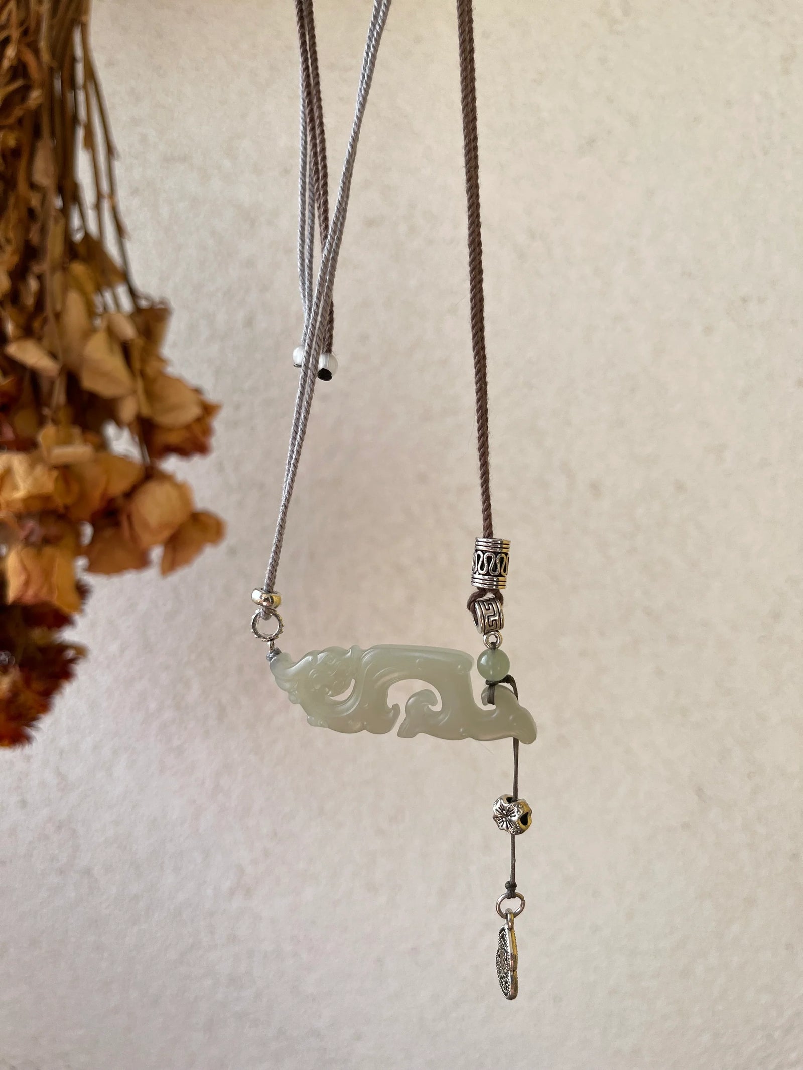 Traditional Motif - Celestial Dragon – Hand-Carved Nephrite Jade Necklace - detail close-up in white by L'Orient Haus