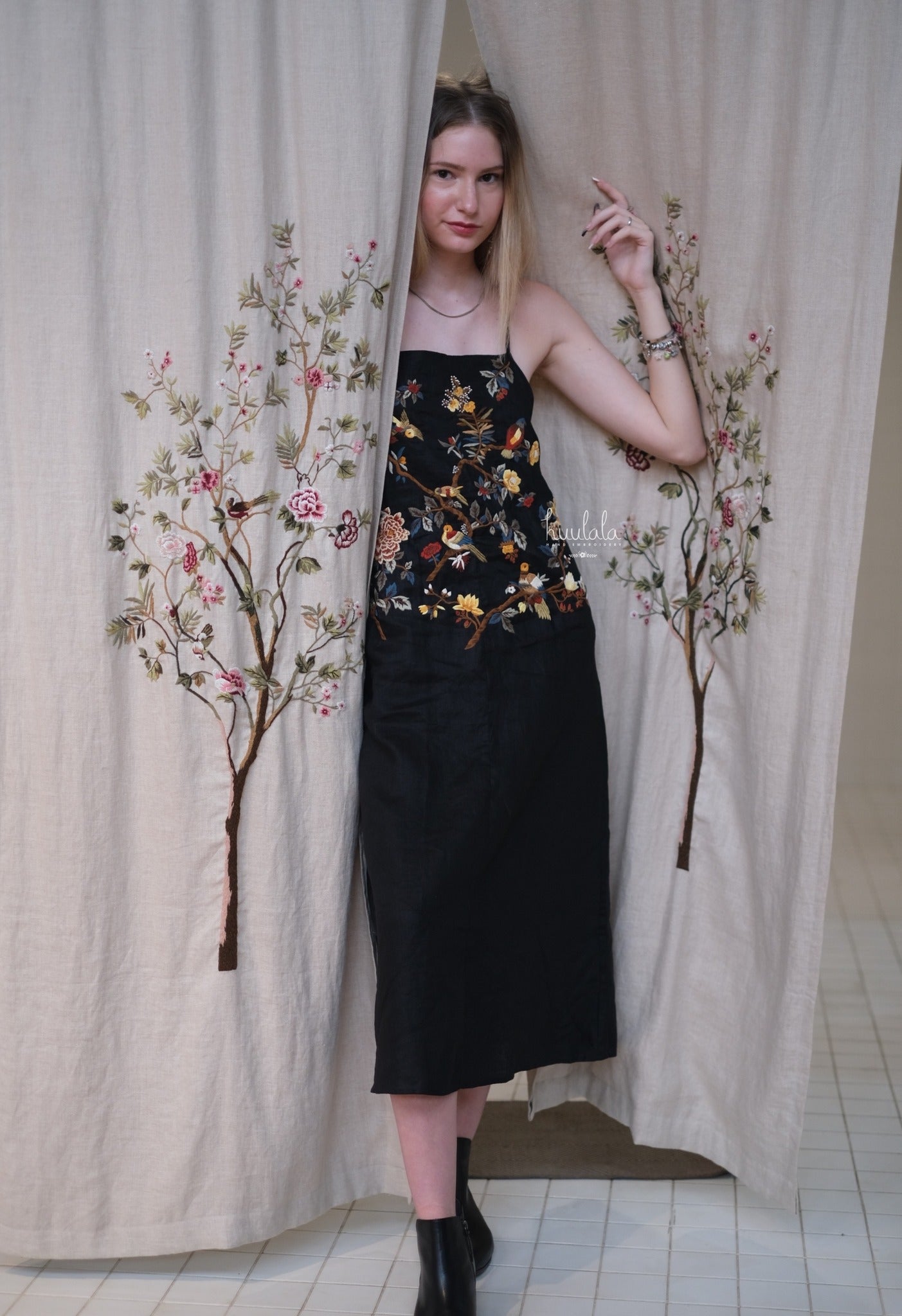 "Song bird" - Embroidered Linen Dress in Beige by Huulala, featuring red floral artisan embroidery on linen fabric.