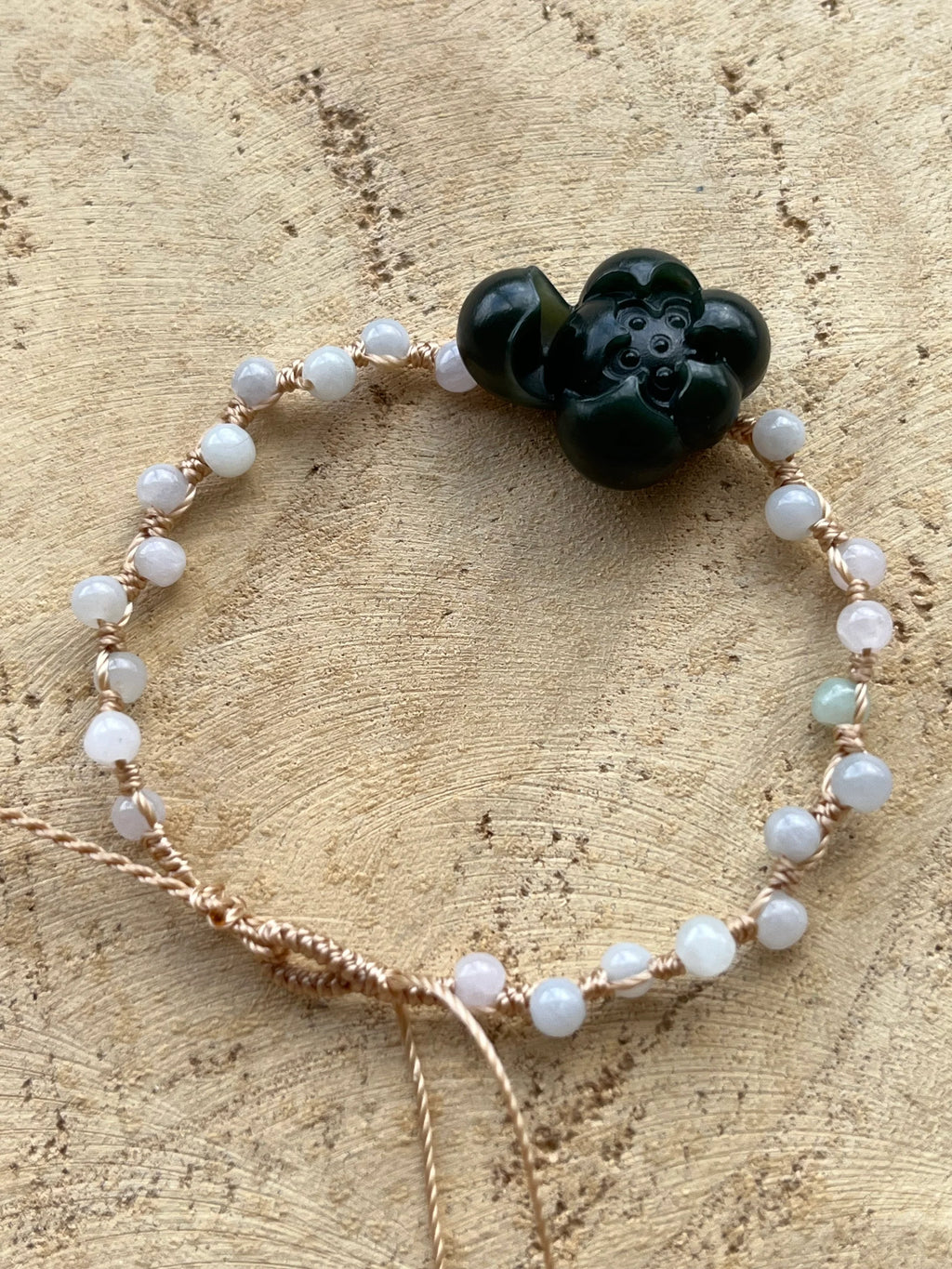 Lotus Noir - Handmade Bracelet with a Dark Cyan Hetian Jade Lotus | 手编和田青玉一细小荷花手牌 - flat lay display by L'Orient Haus