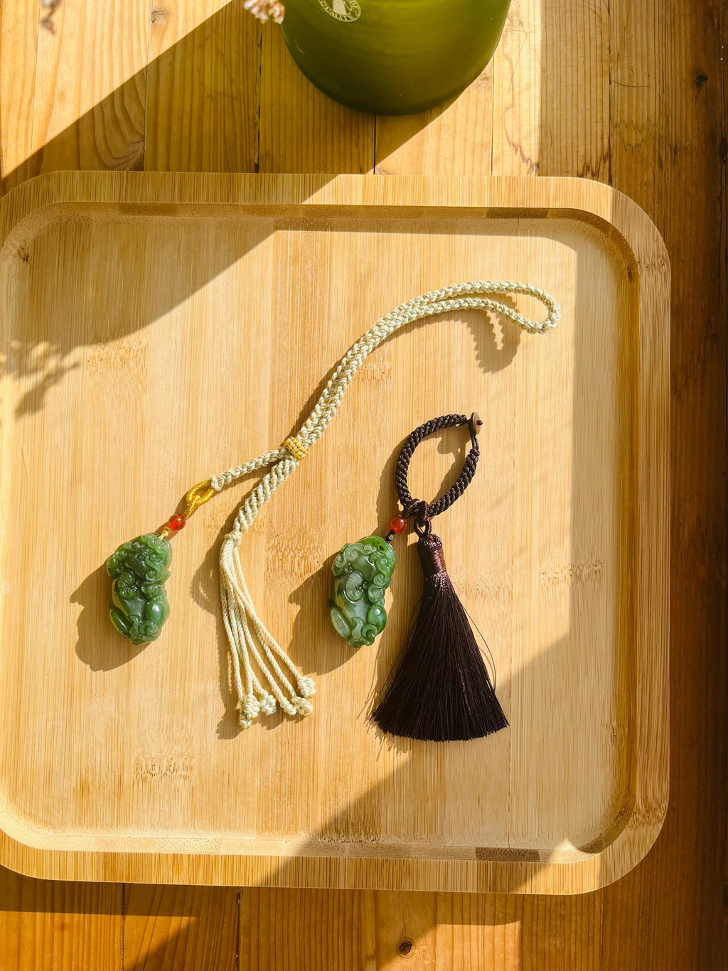 Fortune Fang - Key Chain/Bag Charm with a Carved Green Hetian Jade Pixiu - flat lay display in green by L'Orient Haus