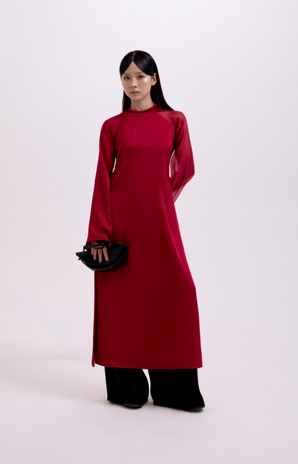 "Traditional Vietnamese Ao Dai 'Tinh Hop' in crimson silk and organza, modern design by UoM"