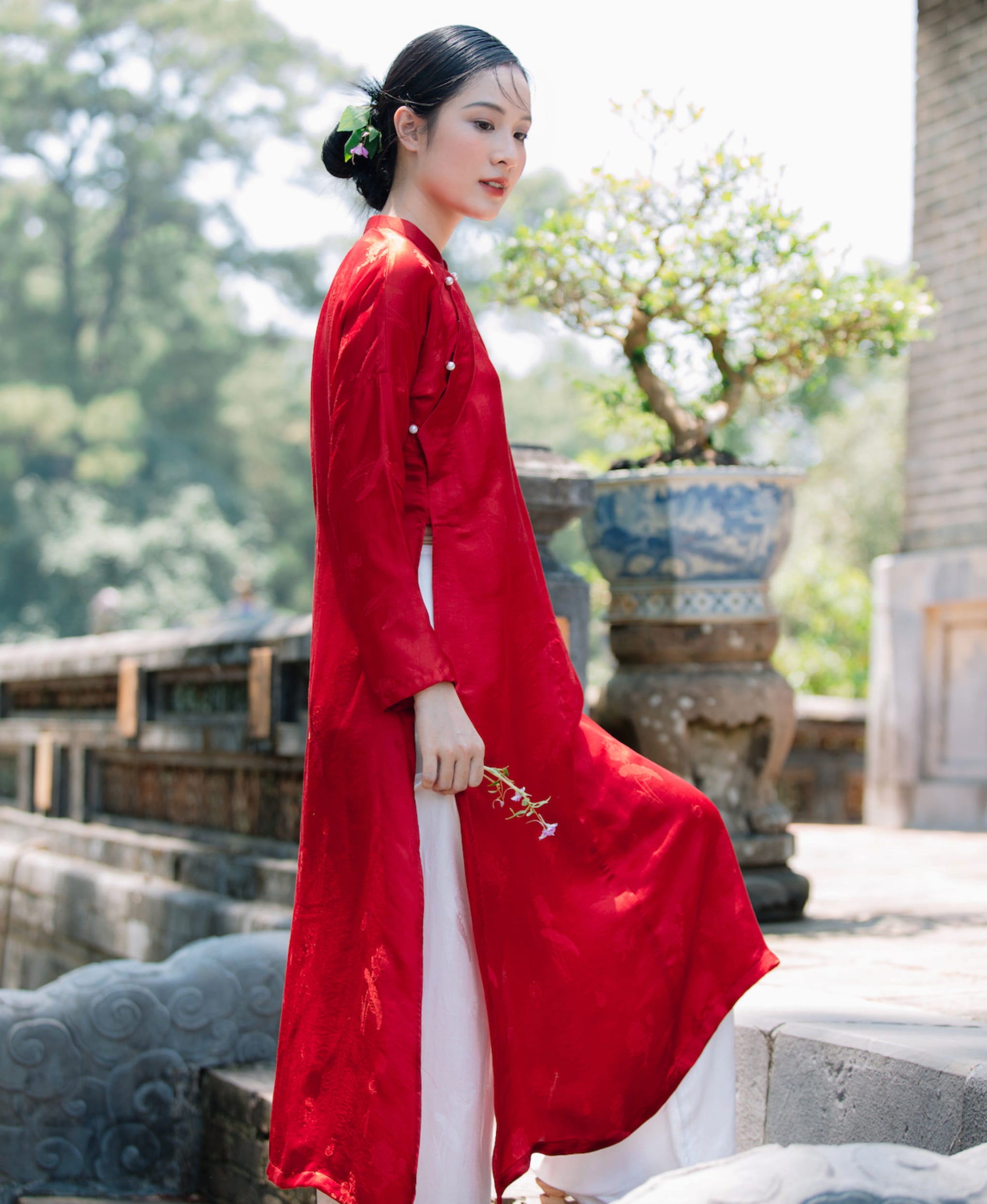 "Traditional Vietnamese Ao Dai in red silkworm silk, artisan-crafted with modern design elements."