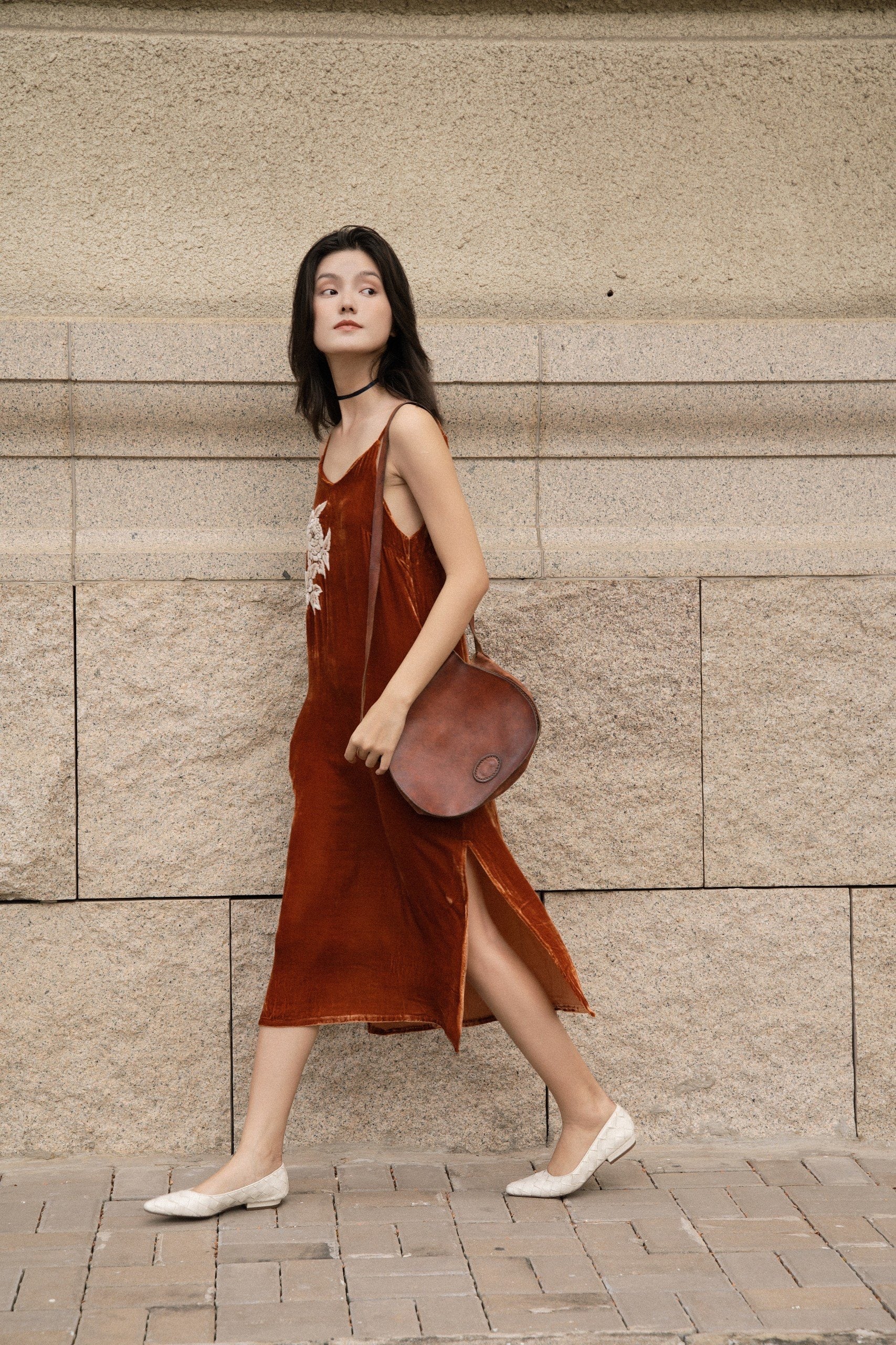 "Rumi embroidered suede tank-top dress in orange by Huulala, featuring white floral embroidery, elegant and modern design."