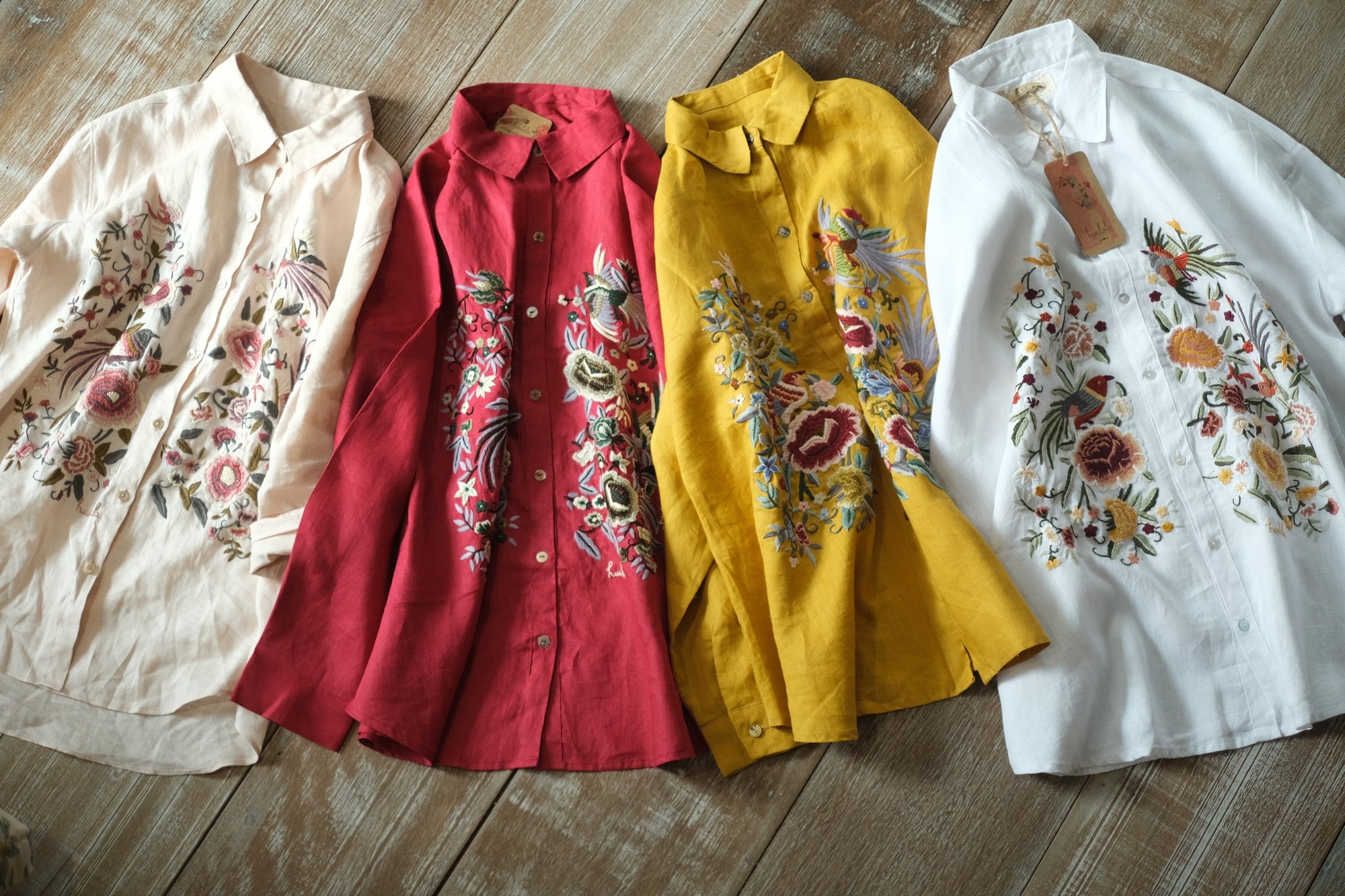 "Spring" embroidered linen shirt in yellow by Huulala, featuring vibrant floral patterns, showcasing Vietnamese cultural authenticity.