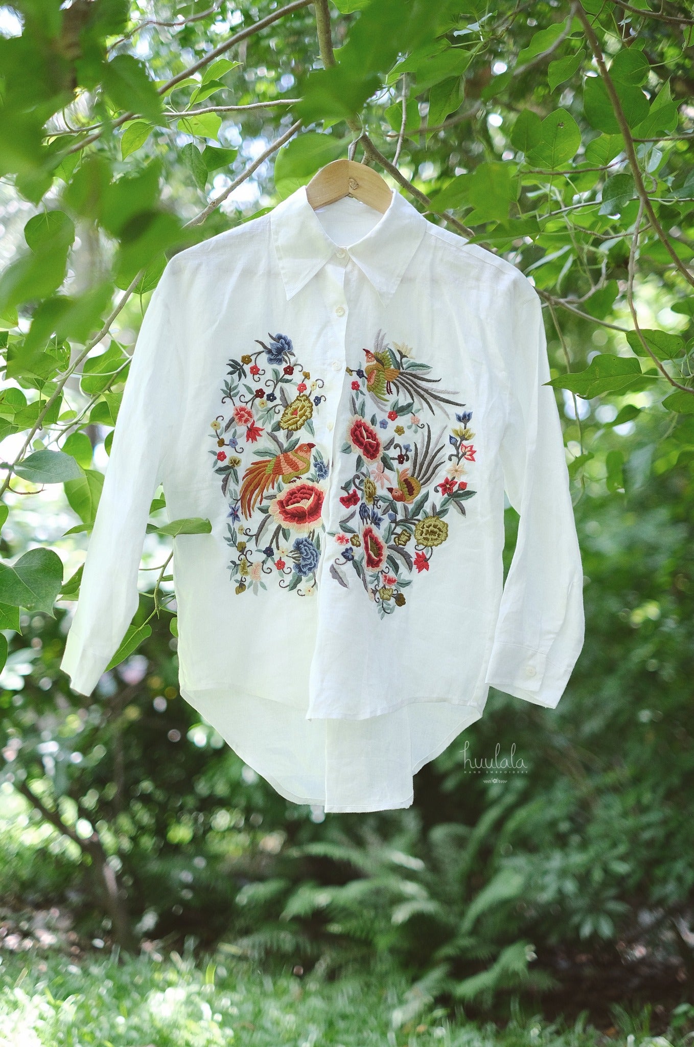 "Zoya embroidered linen shirt in white with pink floral design, Vietnamese cultural fashion by Huulala"