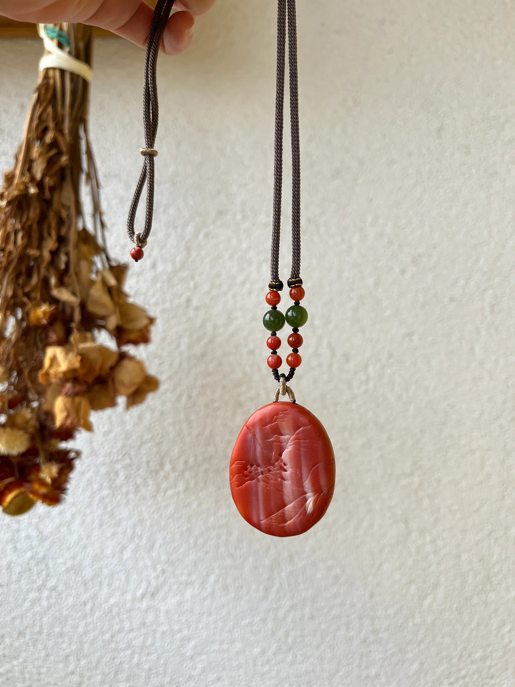 “Crimson Horizon” - Necklace with a Hand Carved Nanhong Agate Landscape Pendant, 手雕南红山水 - front view by L'Orient Haus