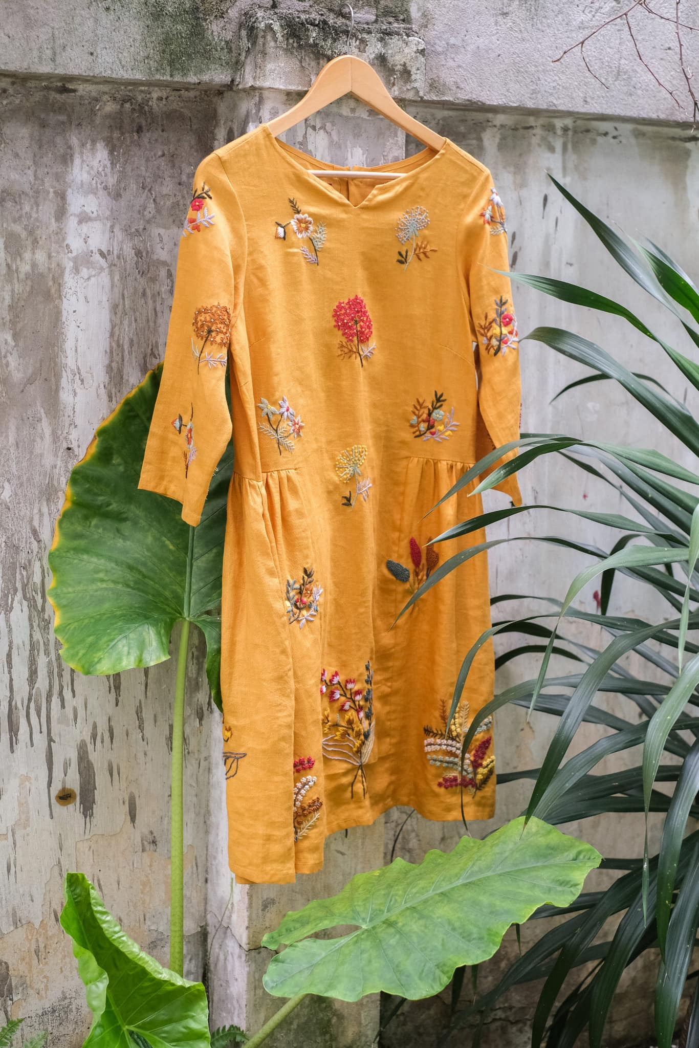 "Vietnamese embroidered linen dress 'Mimosa' in orange with floral patterns by Huulala"