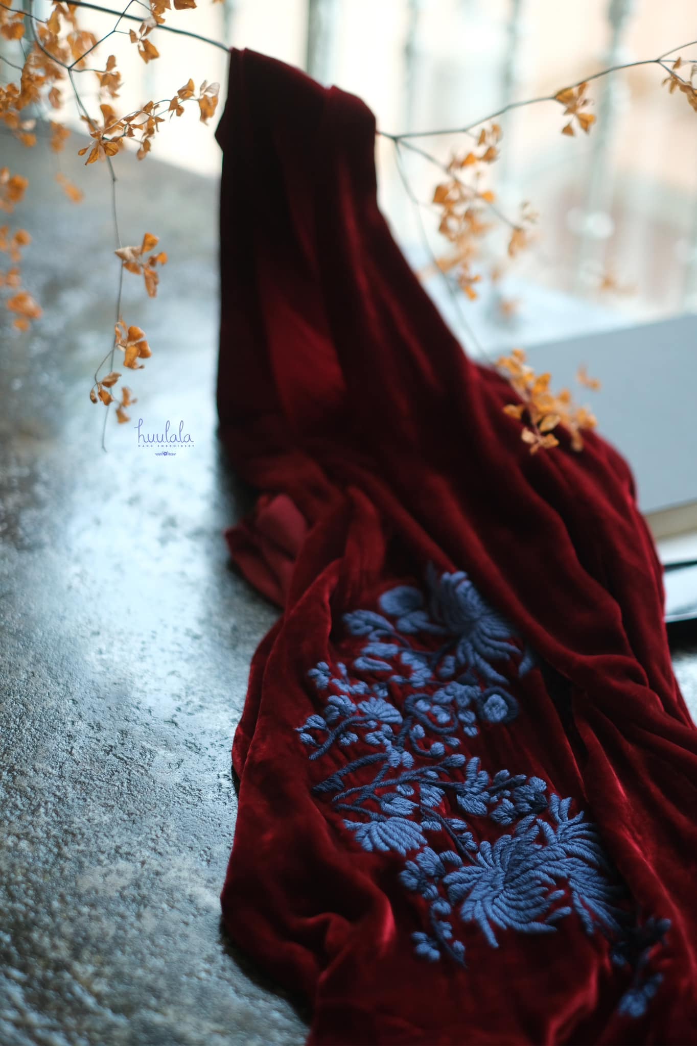 "Rumi - Embroidered Suede Dress in Burgundy by Huulala, featuring blue floral artisan embroidery, cultural authenticity"