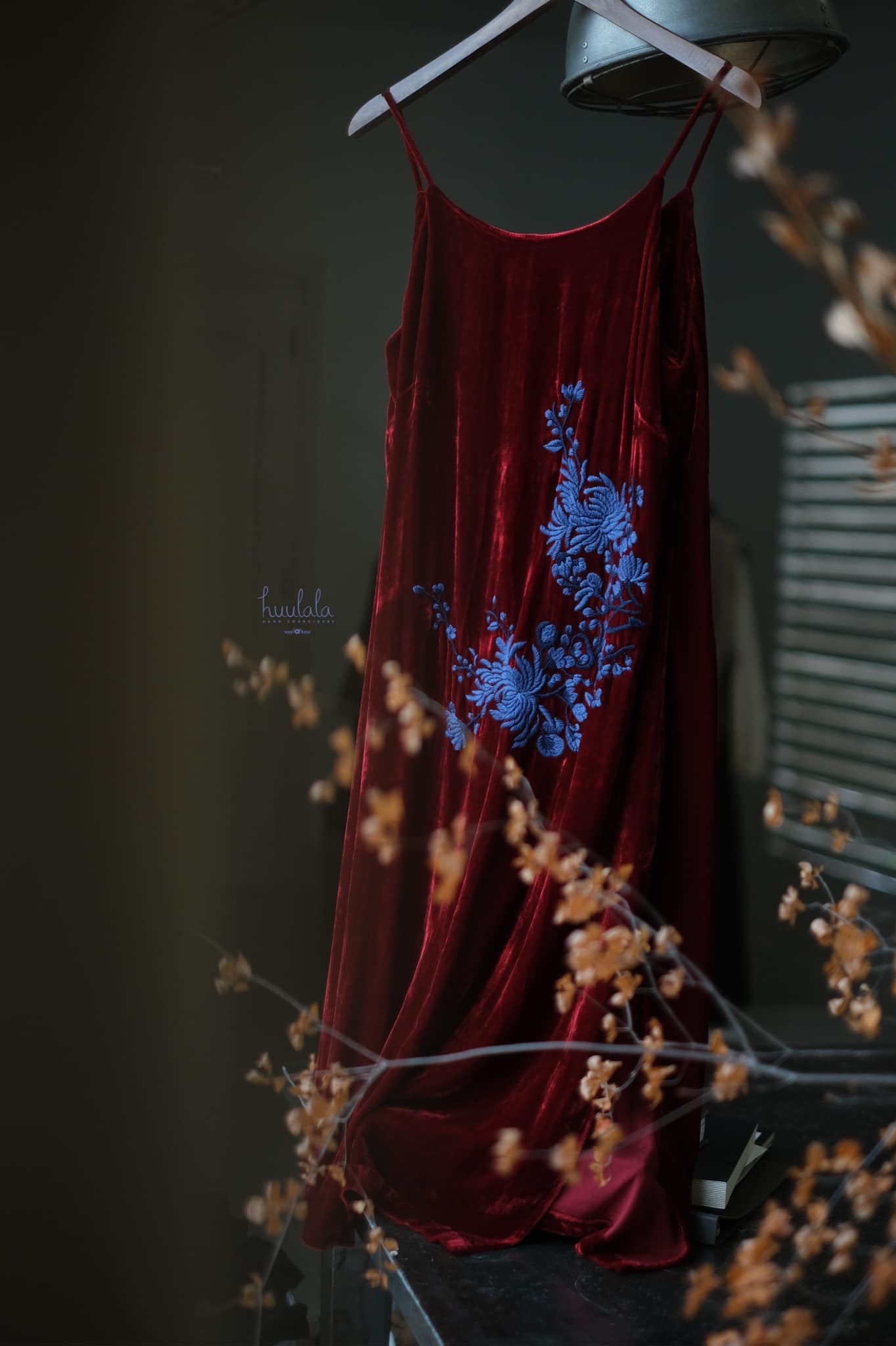 "Rumi" Embroidered Suede Dress in Burgundy by Huulala, featuring blue floral artisan embroidery.