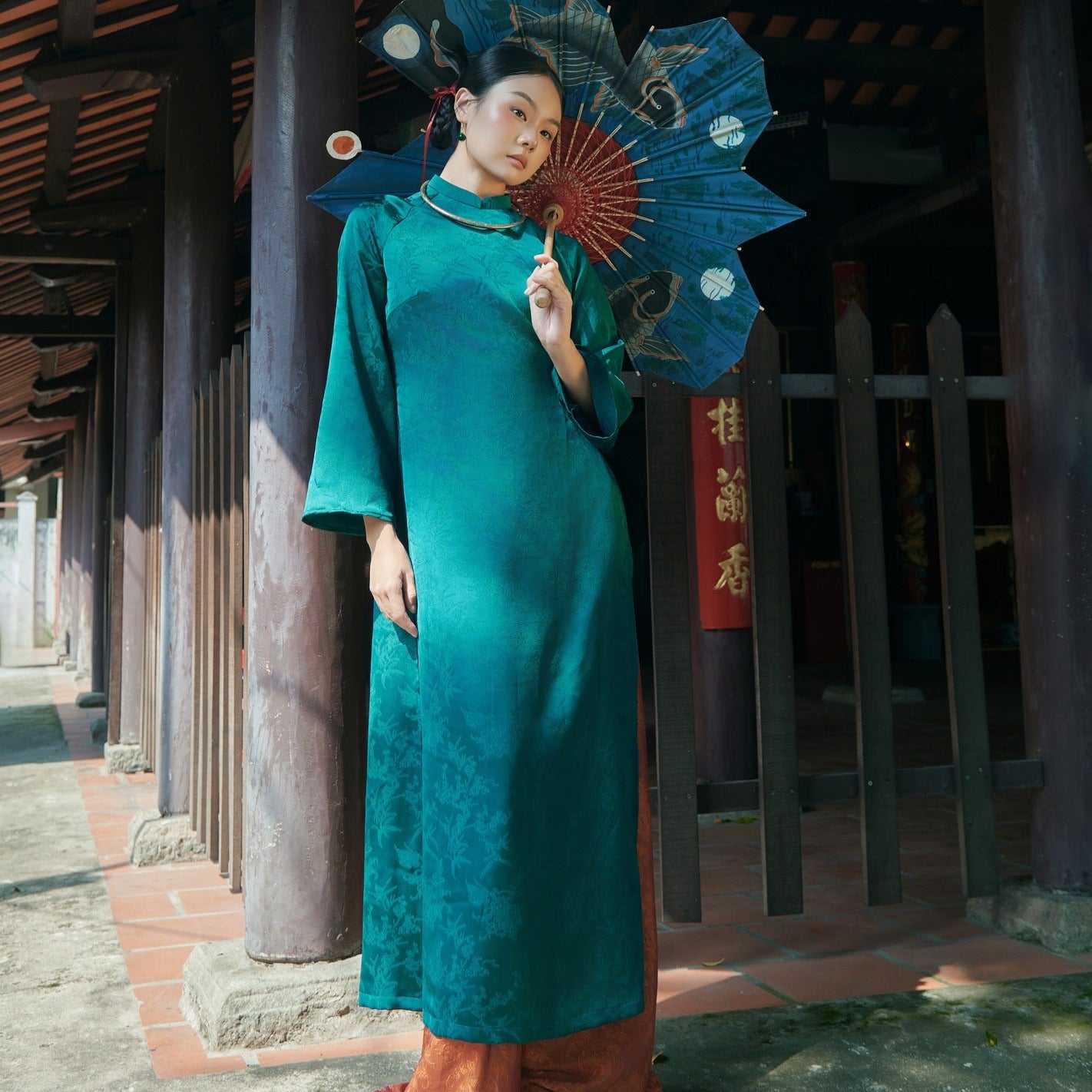 "Truc Khue Ao Dai set in Peacock, traditional Vietnamese dress in red jacquard with modern artisan design."