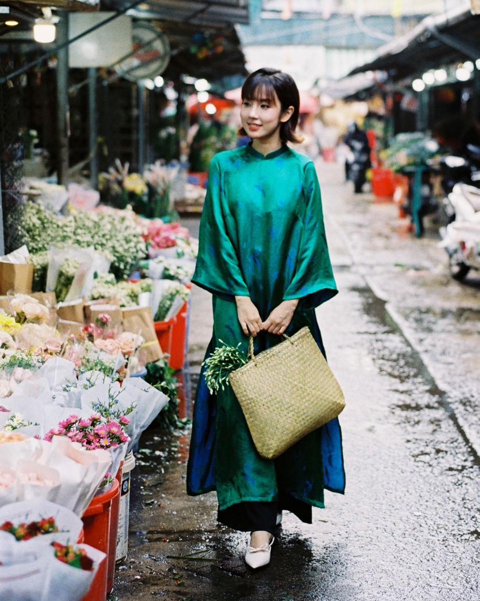 "Traditional Vietnamese Ao dai set 'Lien Hoa' in green silkworm silk by Moc, artisan woven design."