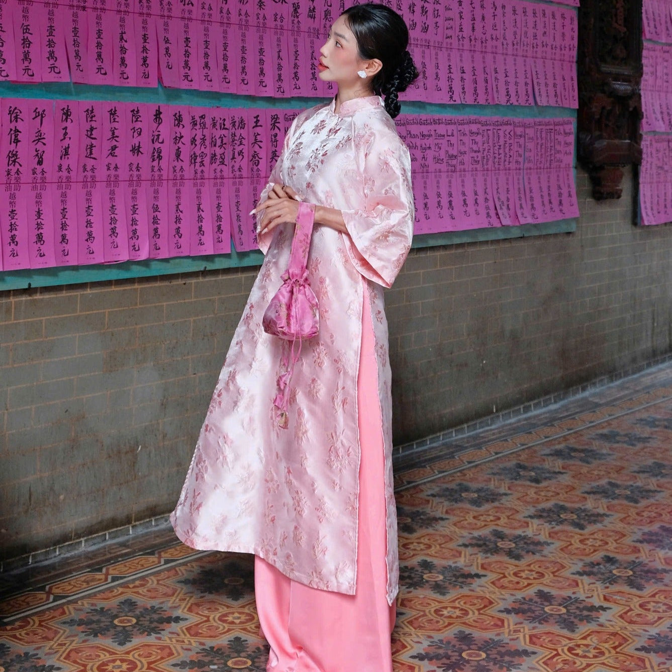 "Giang Dinh Huong Ao Dai set in light pink silk with jacquard floral embroidery, traditional Vietnamese dress."