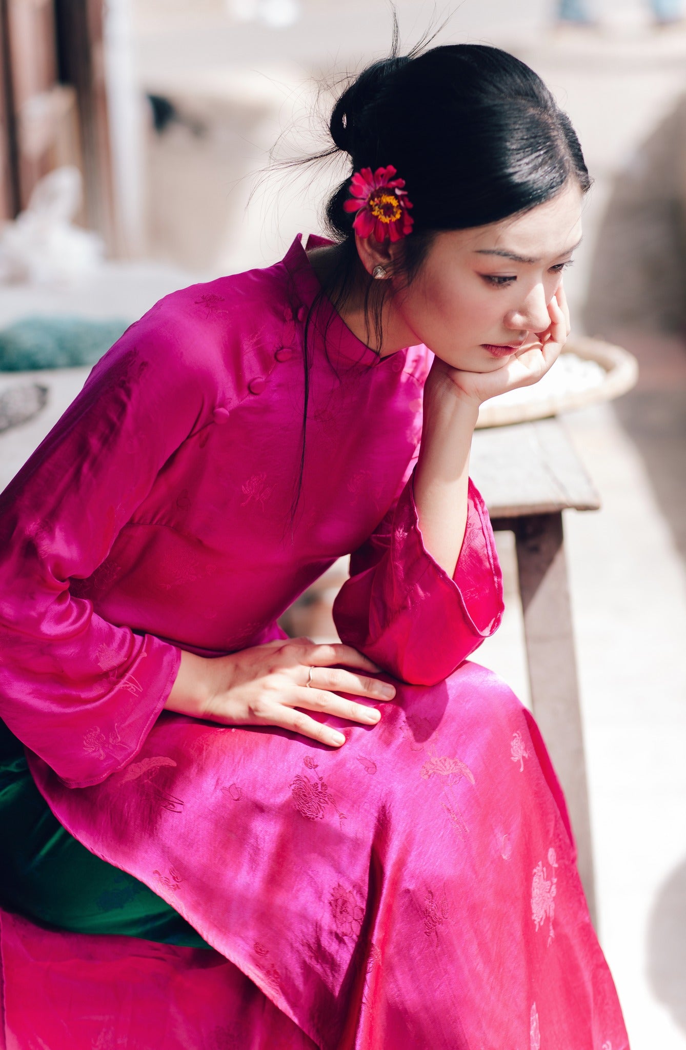 "Magenta silk 'Lien Hoa' Ao Dai set by Moc, traditional Vietnamese dress with modern woven pattern."