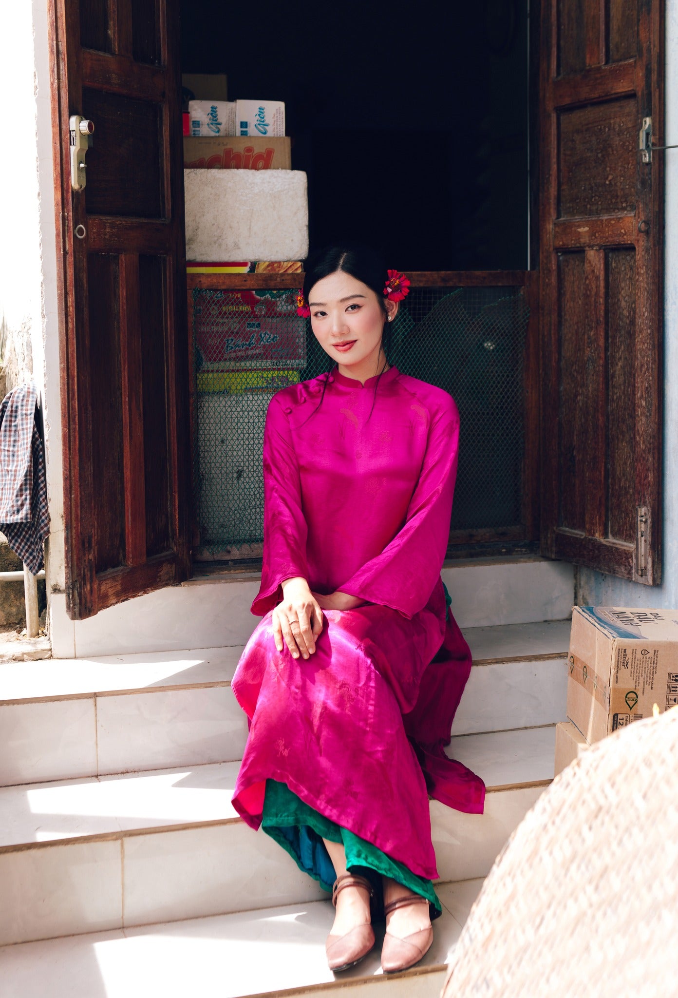 "Traditional Vietnamese Ao dai set 'Lien Hoa' in magenta silkworm silk, featuring modern woven design by Moc."