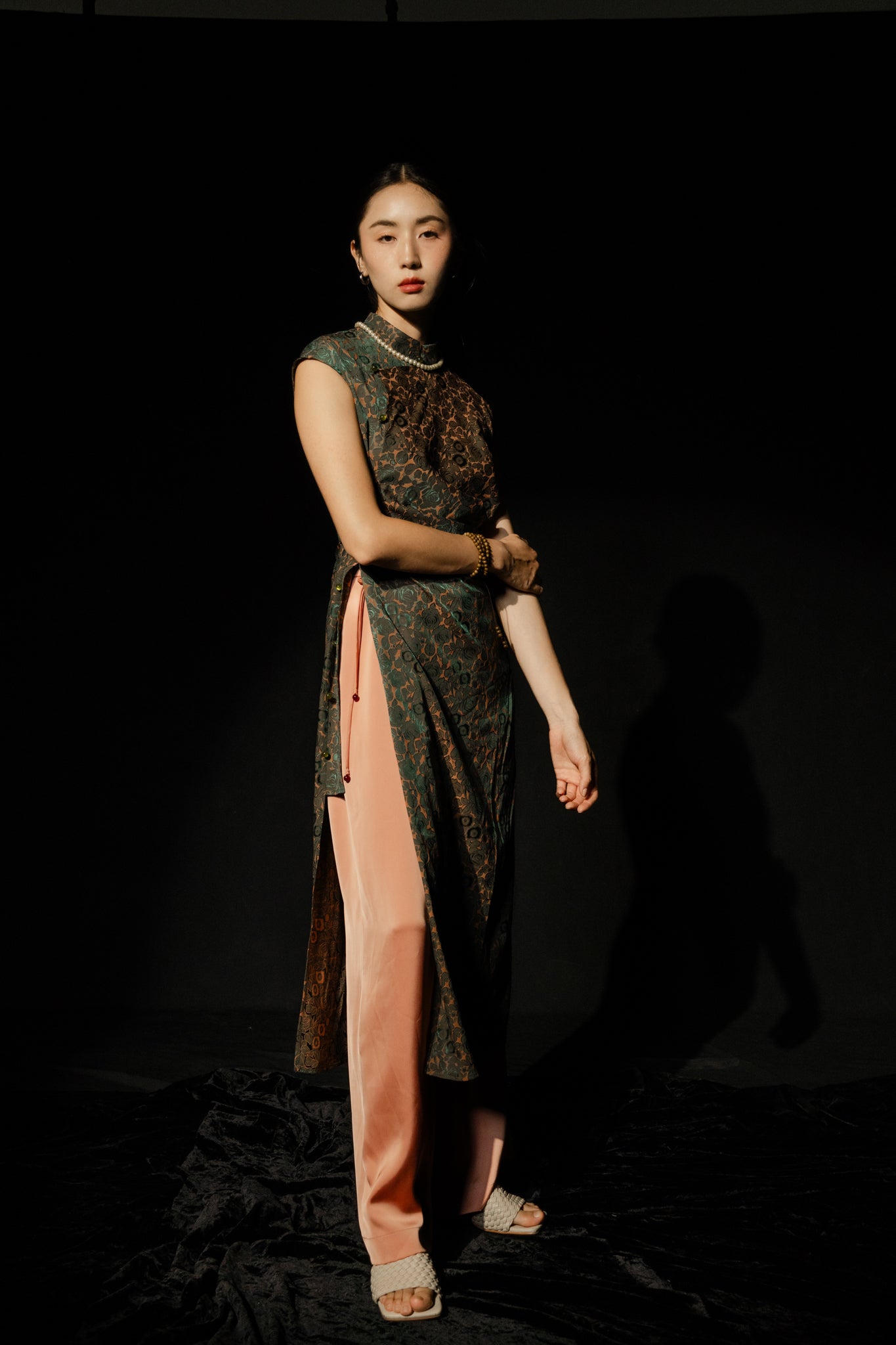 Vietnamese Ao Dai - Hương Trầm - Sleeveless Cheongsam in Black with Jacquard weave - front view in silk in green by Hy Phuong