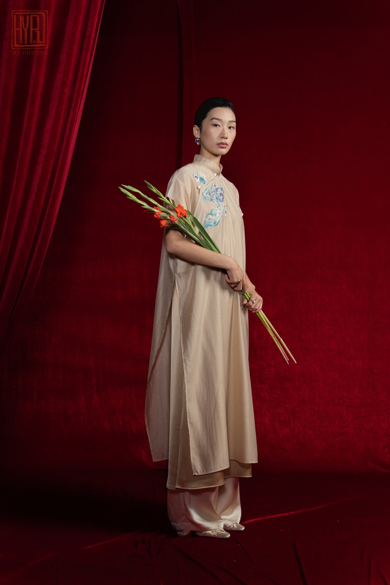 "Van Sa Set - Beige silk Ao dai with modern embroidery, traditional Vietnamese tunic by Hy Phuong."