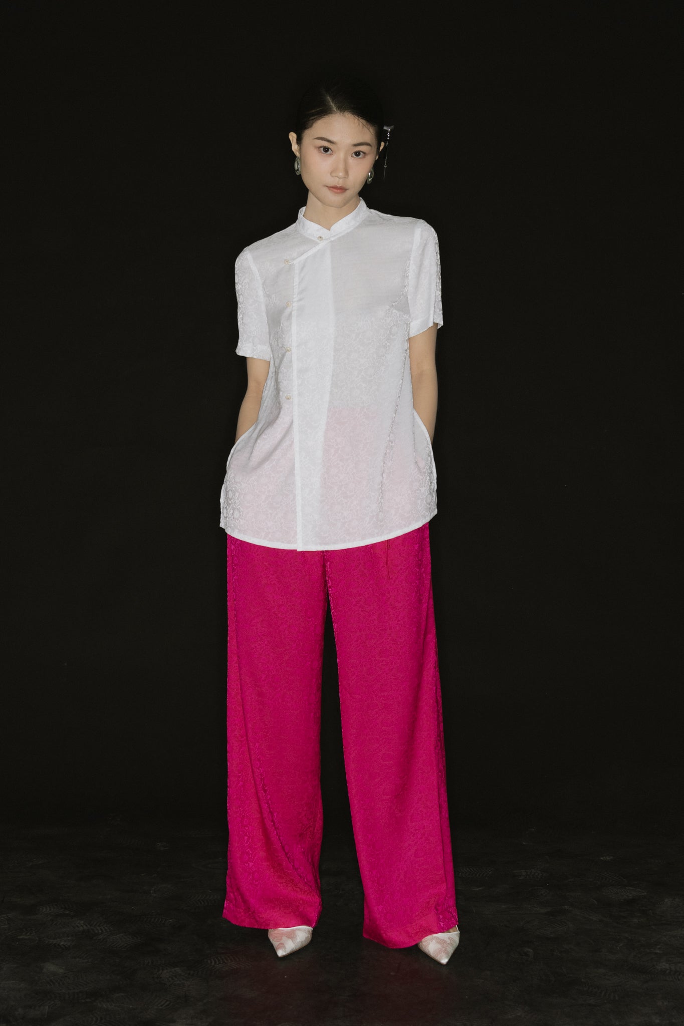 "Vietnamese Tinh Duyen set with white silk Mandarin top and fuchsia wide-leg pants by Hy Phuong"