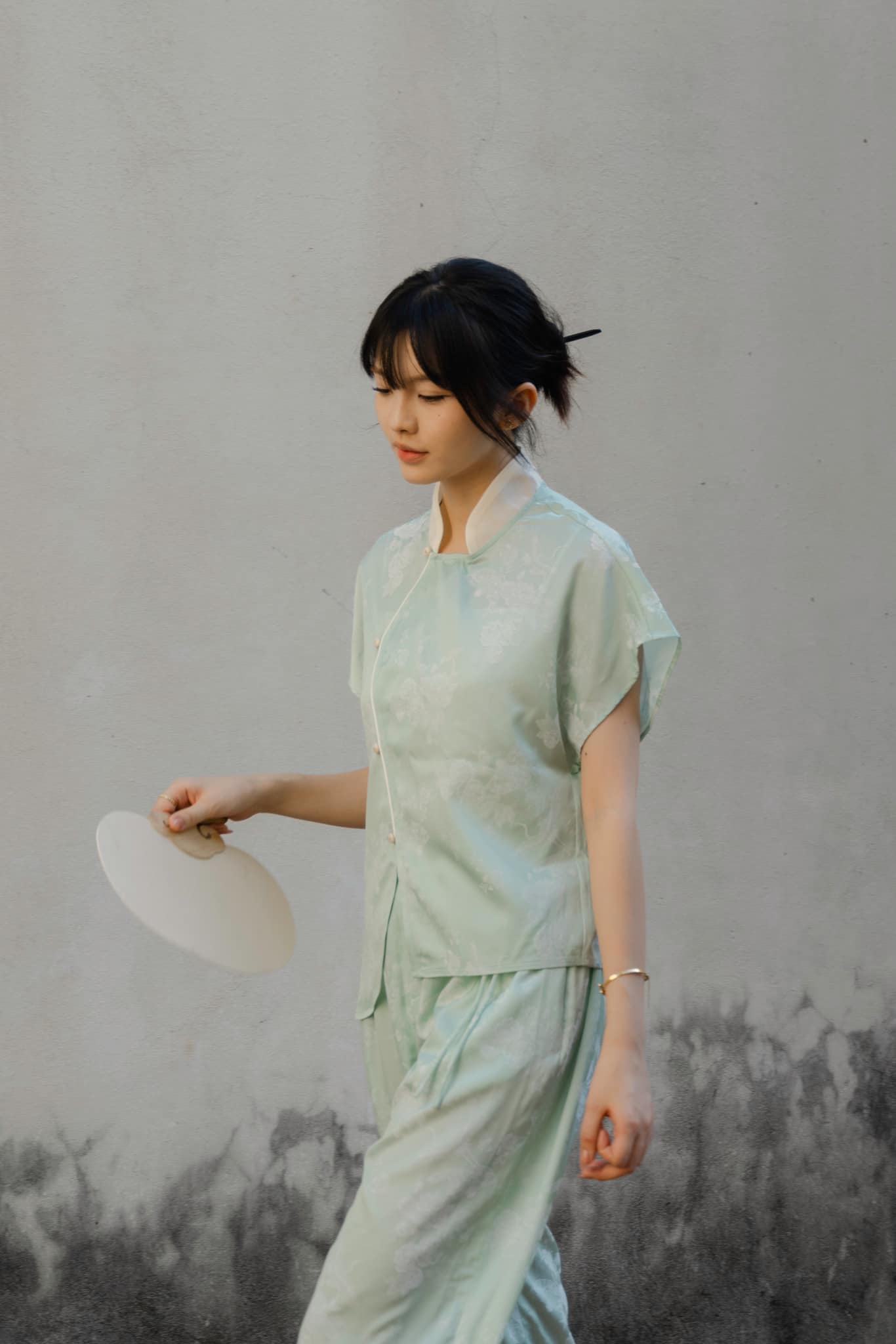 "Nghinh Xuân mint green jacquard top by Hy Phuong, modern Vietnamese design with mandarin neck."