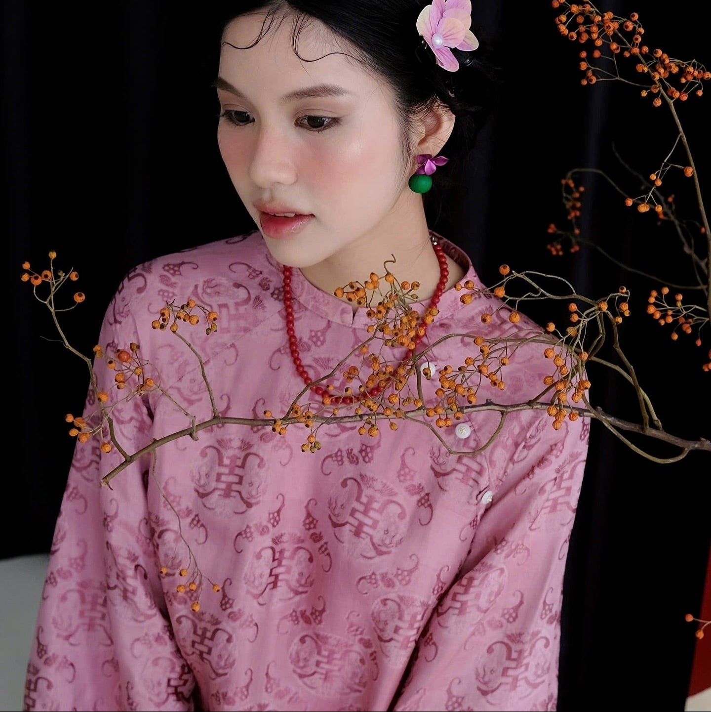 "Tra My Mandarin-neck top in light pink woven silk, modern pattern, cultural authenticity by Garderobe."