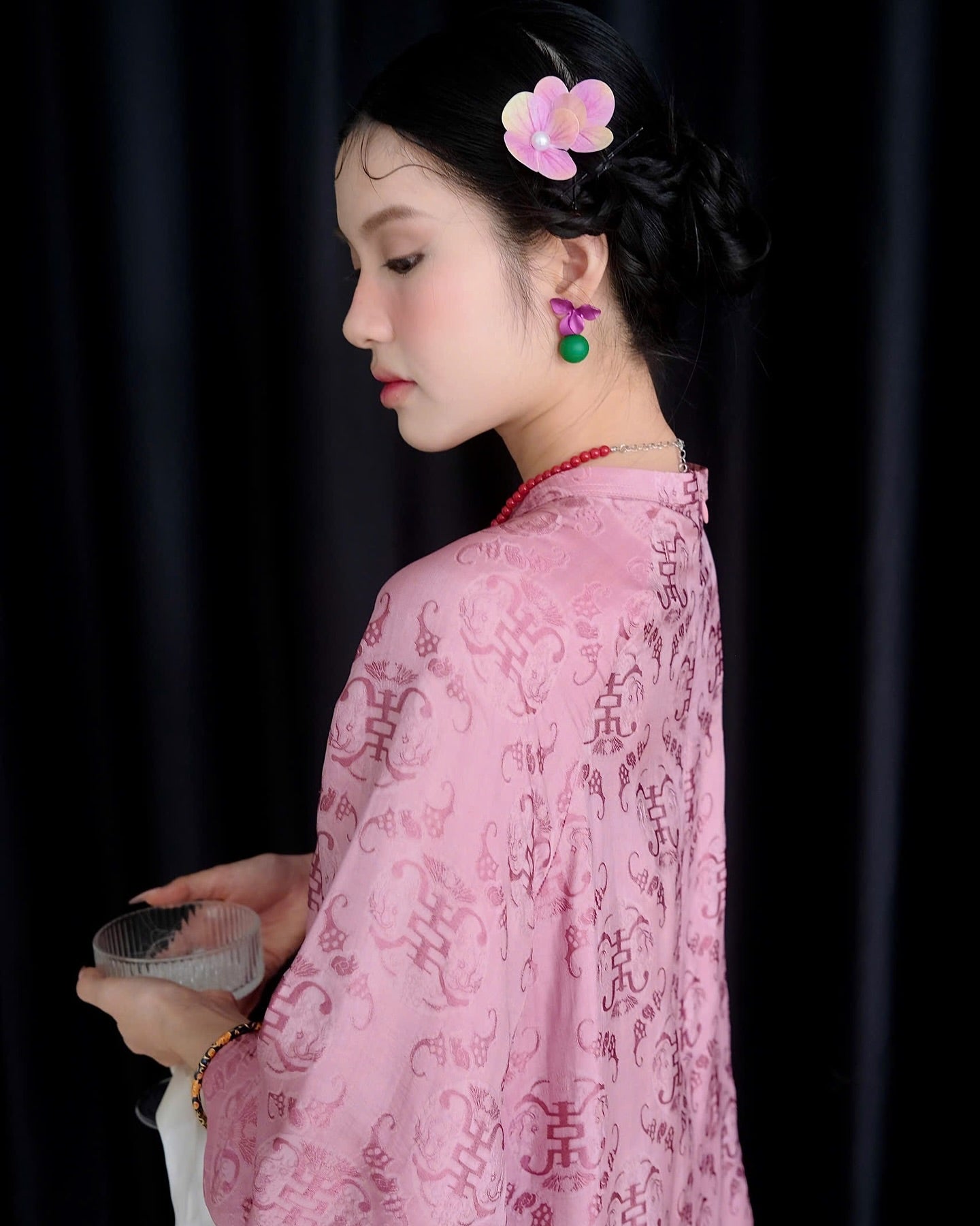 "Tra My Mandarin-neck top in light pink woven silk, modern pattern, cultural authenticity"